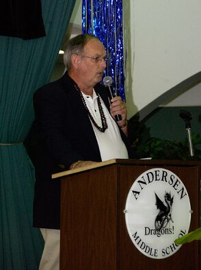 ANDERSEN AIR FORCE BASE, Guam -- Bill Hall, Andersen Middle School principal, gives opening remarks to guests at the eighth-grade promotion ceremony in the Dragon Theater June 11. Mr. Hall will retire Aug. 1 with 42 years of service dedicated to educating the leaders of tomorrow. (U.S. Air Force photo by Airman Carissa Wolff)          