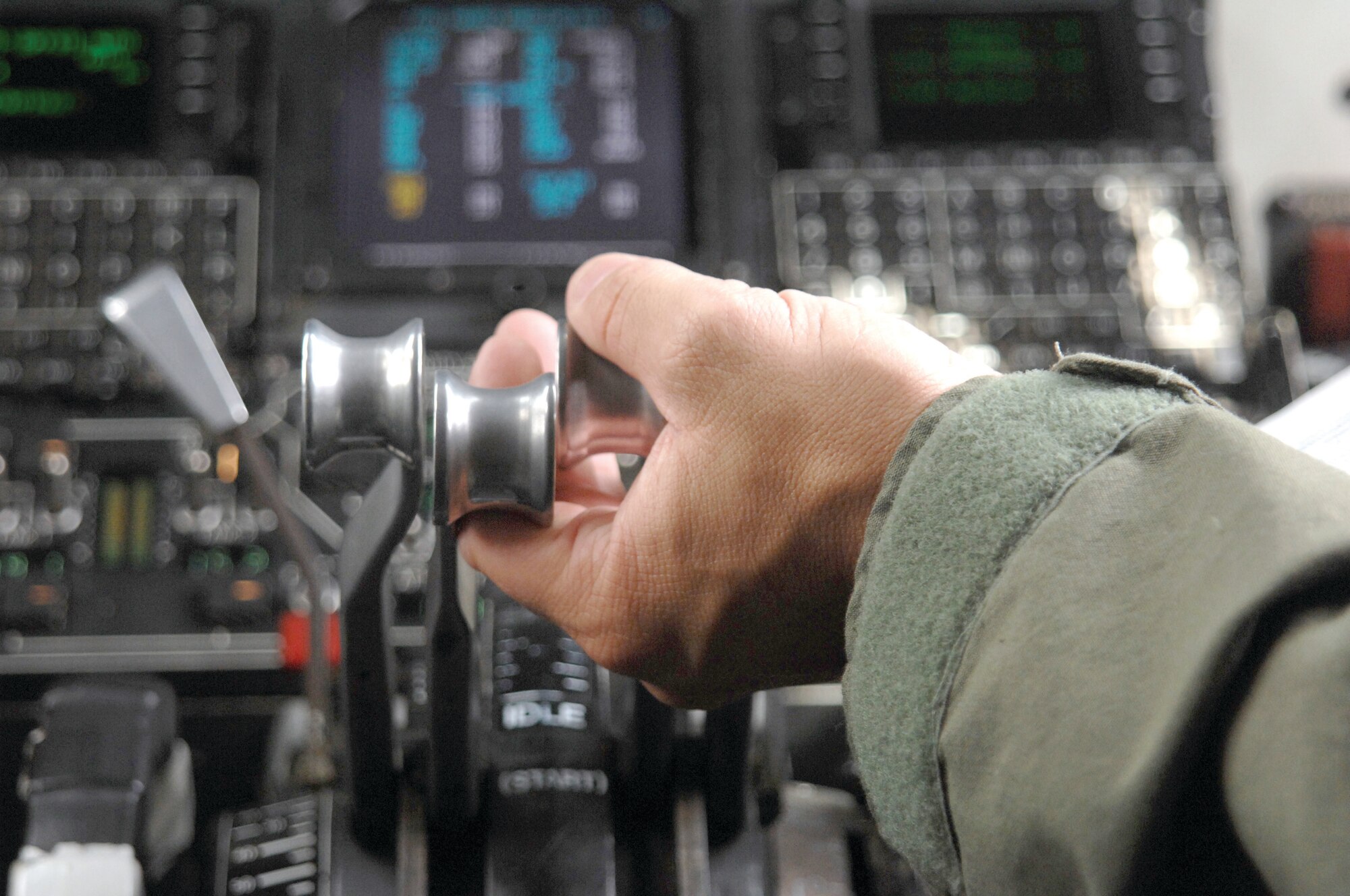 2nd Lt. Charles Roberts of the 336th Air Refueling Squadron, March ARB, mans the throttles and performs the landing checklist in a KC-135R Stratotanker during a training flight approach on San Clemente Island.  (U.S. Air Force photos by Senior Master Sgt. Michael Du)