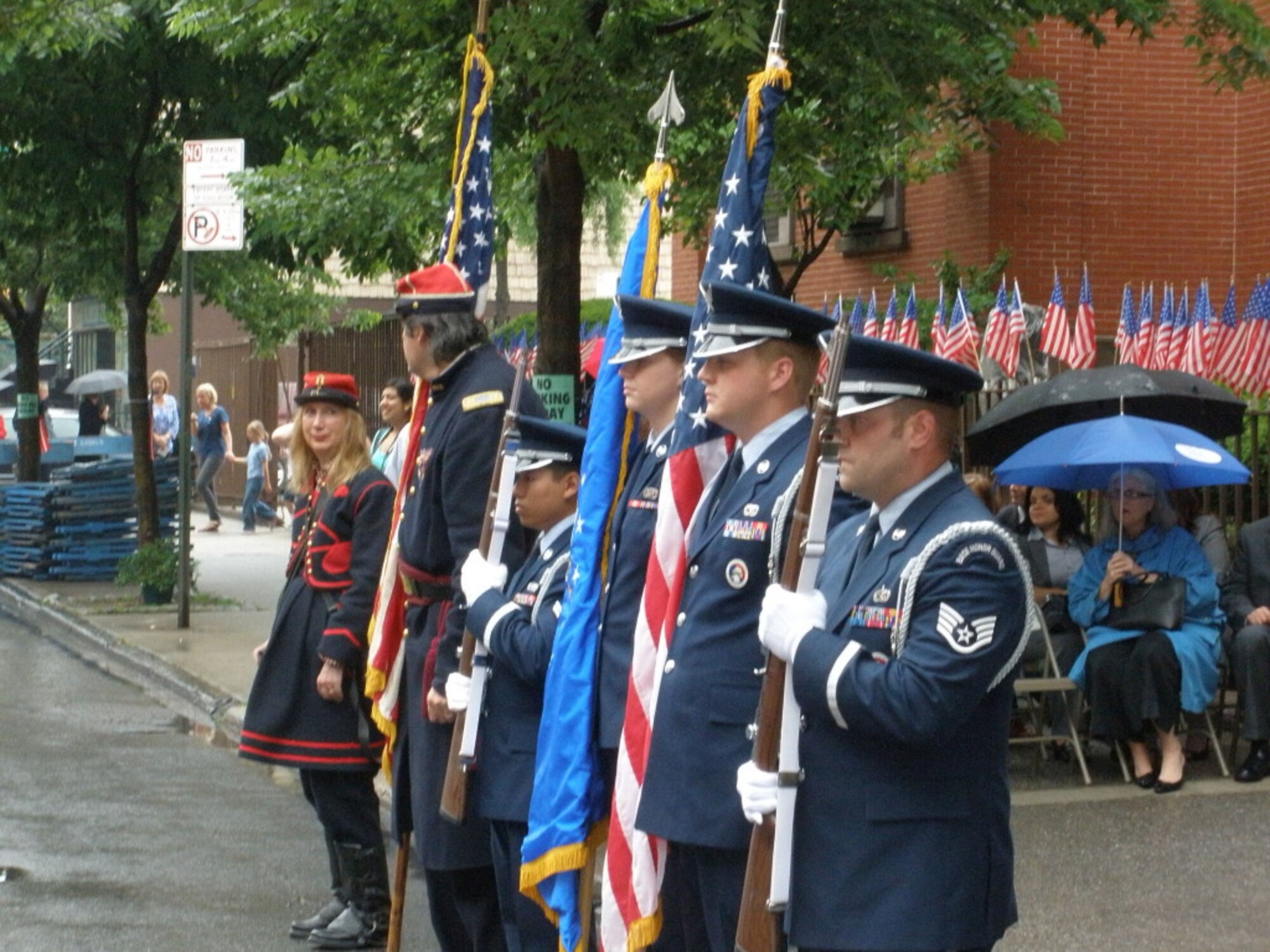Members of Joint Base McGuire-Dix-Lakehurst's Honor Guard, from right, SSgt Christopher Castle, Airman 1st Class Bryan Rogers, Amn Jessica Peterson, and Airman 1st Class Aldrine Estrella, present colors for  the Oliver Perry-Public School 34, on June 12 in Brooklyn, N.Y. The school and the community celebrated Flag Day and McGuire's Honor Guard, with assistance from two members of the Greenpoint Historical Society's ceremonial guard, anchored the ceremony. (U.S. Air Force photo/Terrance Holliday)