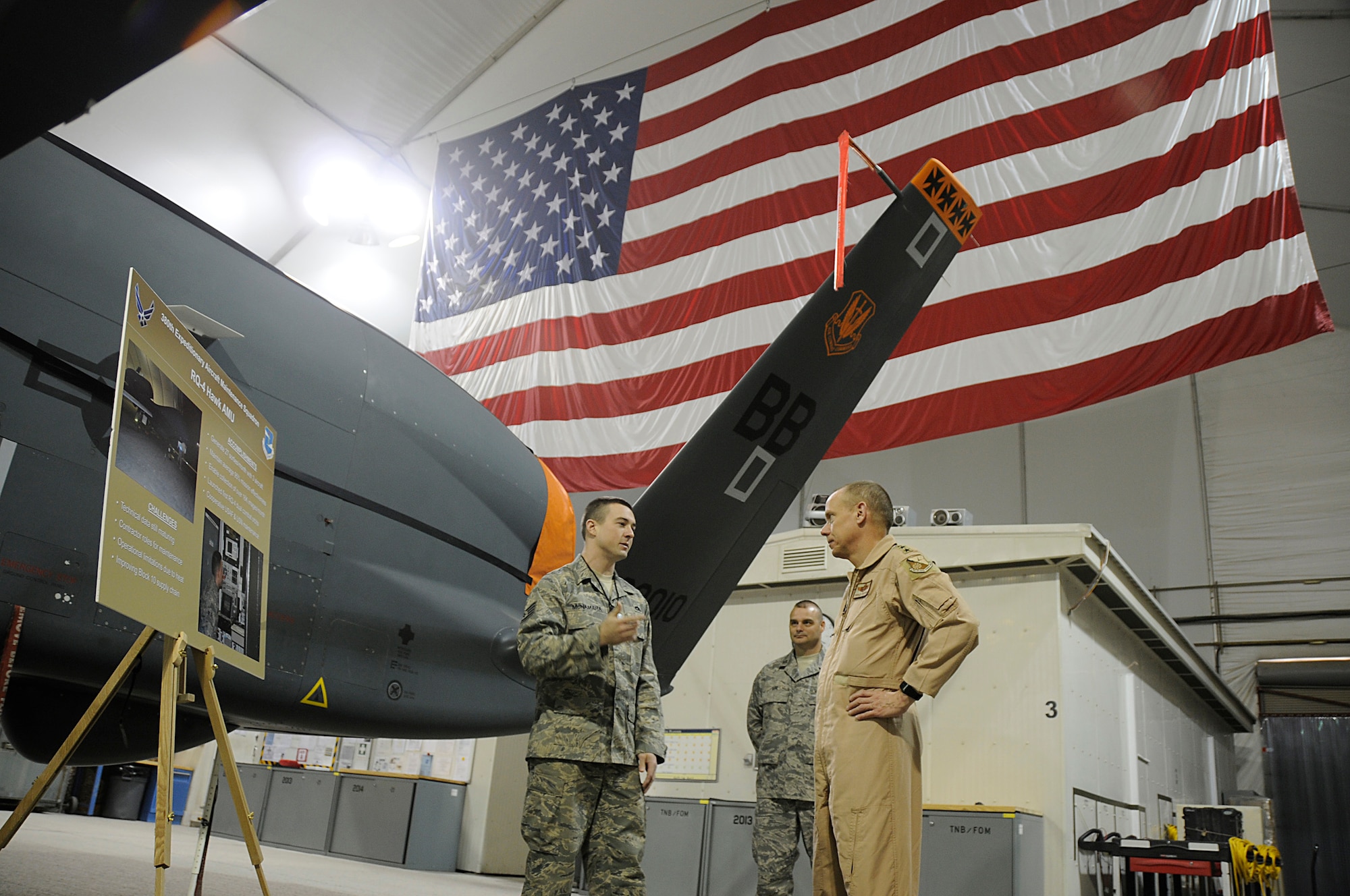 Gen. Donald J. Hoffman is briefed on RQ-4 Global Hawk operations during a visit with the 380th Air Expeditionary Wing in Southwest Asia in February. Air Force and Northrop Grumman officials will unveil the first Block 40 version of Global Hawk June 25 at Air Force Plant 42 in Palmdale, Calif. The Block 40 variant adds Battle Management and Control capability. The Aeronautical Systems Center at Wright-Patterson Air Force Base, Ohio, manages the RQ-4 fleet. General Hoffman is the Air Force Materiel Command commander. (U.S. Air Force photo/Senior Airman Brian J. Ellis) 
