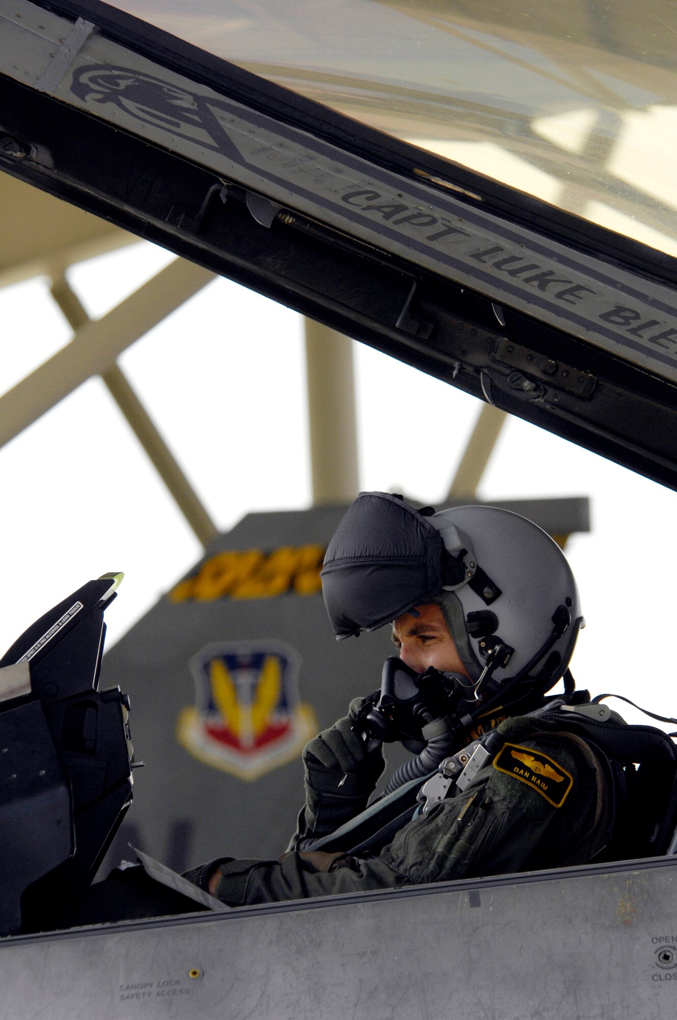 SHAW AIR FORCE BASE, S.C. -- Capt. Dan Naim, 79th Fight Squadron fighter pilot, adjusts his mask before his sortie during Team Shaw's operational readiness inspection, June 16. Naim's sorite will be one of 240 scheduled for the ORI. The ORI will evaluate Shaw's ability to survive and operate in combat conditions. (U.S. Air Force photo/Senior Airman Kathrine McDowell)