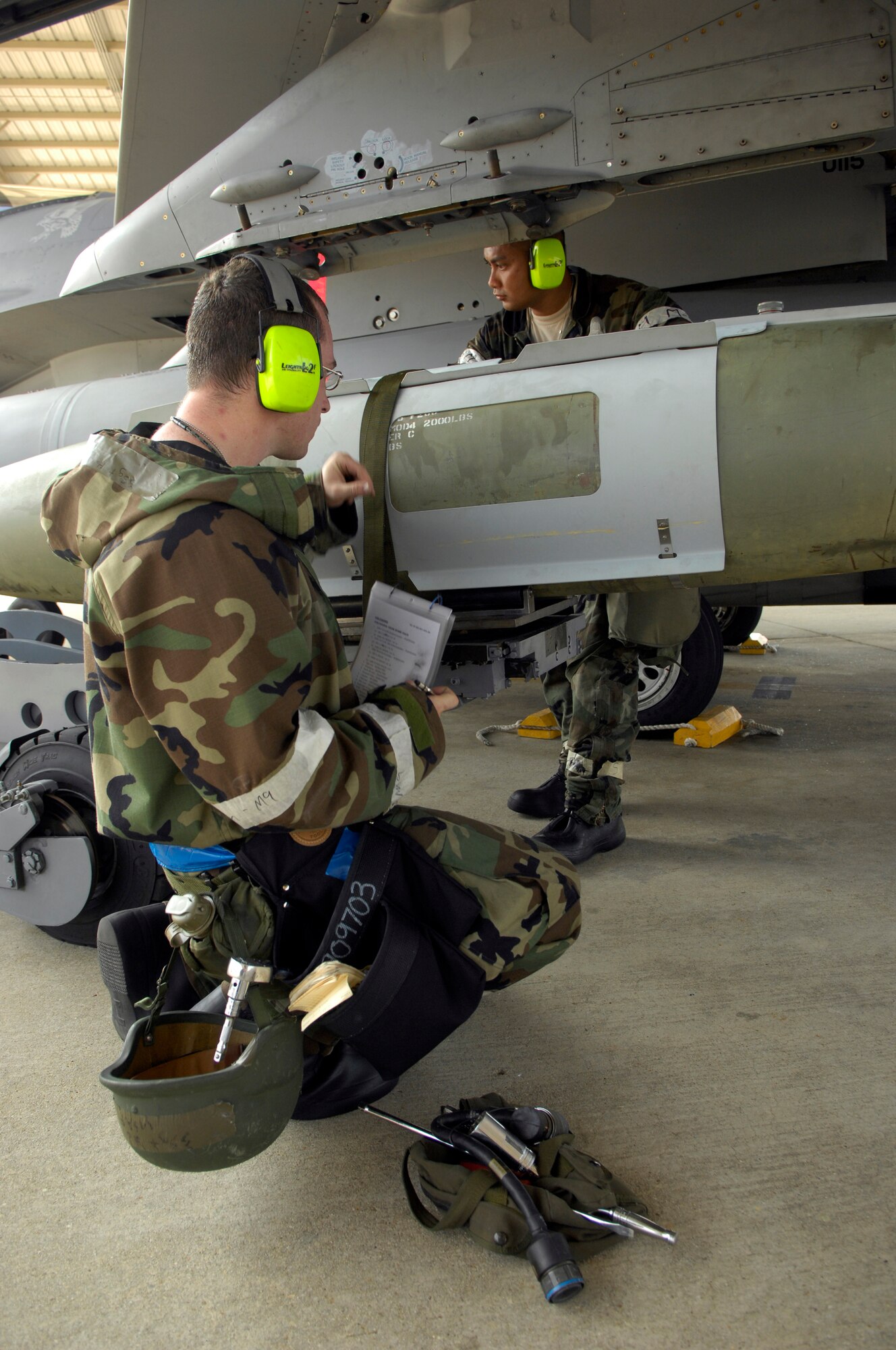 SHAW AIR FORCE BASE, S.C. -- 20th Aircraft Maintenance Squadron members Staff Sgt. Mark Holland, left, and Airman 1st Class Holy Douagmala, unload munitions from an F-16 aircraft during Team Shaw's operational readiness inspection, June 16. The ORI will evaluate Shaw's ability to survive and operate in combat conditions. (U.S. Air Force photo/Senior Airman Kathrine McDowell)