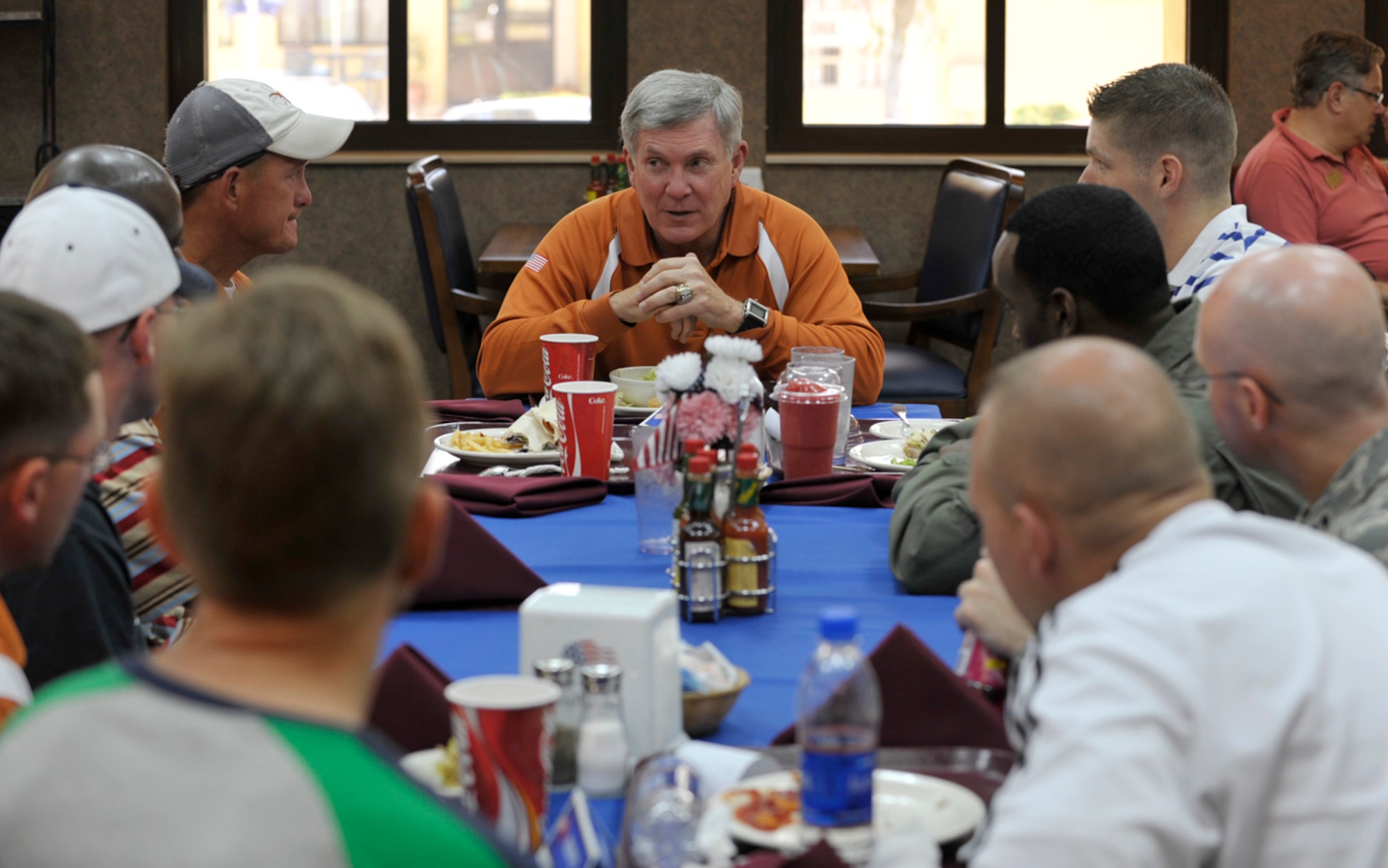 Mack Brown, head football coach at Texas University, talks to Airmen during a Sunday lunch at Incirlik Air Base, Turkey. The base was an early stop during Coaches Tour 2009, a morale-boosting mission that brought NCAA football coaches to U.S. servicemembers overseas. (U.S. Air Force photo/Tech. Sgt. Jason Schaap)
