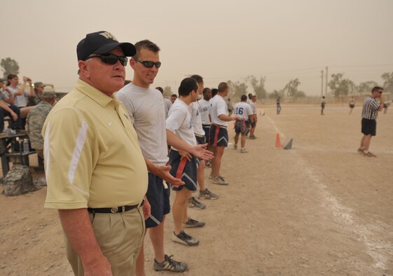 Wake Forest football coach Jim Grobe stands on the sideline during an Air Force versus Army football game at Joint Base Balad, Iraq, on May 31. Grobe and six other NCAA football coaches voiced their support for the Airmen and Soldiers in the game despite a storm that filled the air with sand. (U.S. Air Force photo/Tech. Sgt. Jason Schaap) 