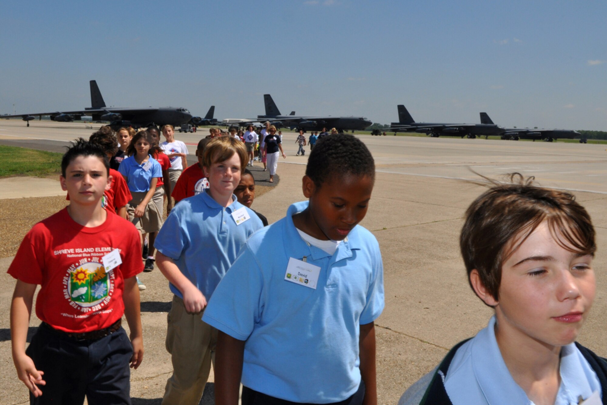 STARBASE Louisiana program students tow the line, making sure not to break the “red” line, while returning to their bus after a briefing about a B-52 Stratofortress at Barksdale Air Force Base, La., June 16, 2009. The local program, which is one of 60 national STARBASE sites, is sponsored by the 917th Wing of the Air Force Reserve Command at Barksdale AFB. The program presents an exciting 25-hour hands on/minds on aviation and aerospace curriculum to area 5th grade students and their teachers.  Over an average school year the 917th Wing will hosted over 60 tours for STARBASE classes at both the 93rd Bomb Squadron and the 47th Fighter Squadron. (U.S. Air Force photo/Tech. Sgt. Jeff Walston)