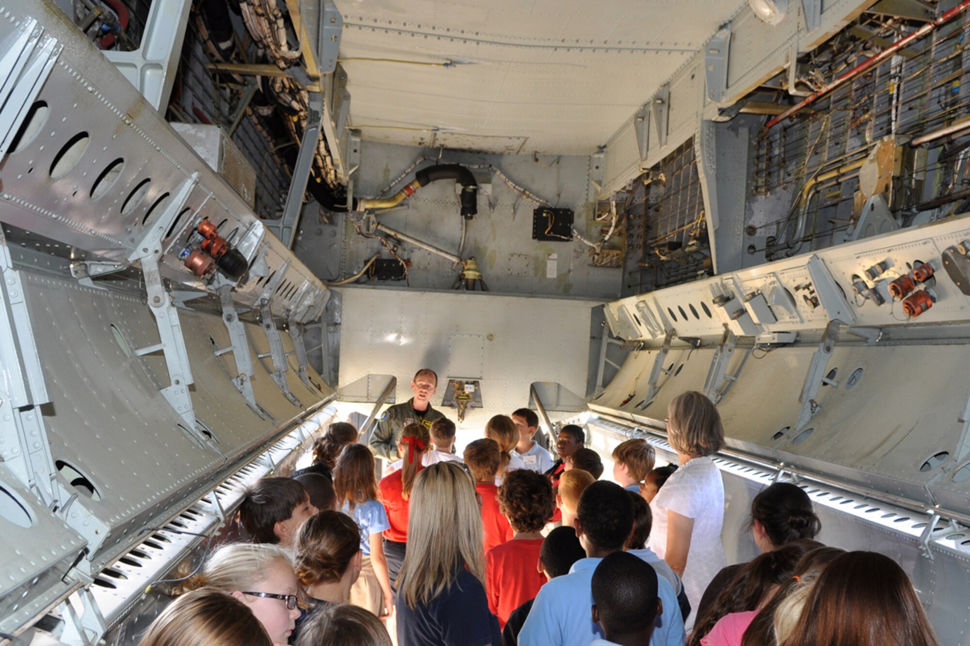 Lt. Col. Al Ringle, 93rd Bomb Squadron, instructor radar navigator, explains the payload capabilities of the B-52 Stratofortress bomb bay to 5th graders in the STARBASE Louisiana program at Barksdale Air Force Base, La., June 16, 2009. The local program, which is one of 60 national STARBASE sites, is sponsored by the 917th Wing of the Air Force Reserve Command at Barksdale AFB. The program presents an exciting 25-hour hands on/minds on aviation and aerospace curriculum to area 5th grade students and their teachers. Over an average school year the 917th Wing will hosted over 60 tours for STARBASE classes at both the 93rd BS and the 47th Fighter Squadron. (U.S. Air Force photo/Tech. Sgt. Jeff Walston)