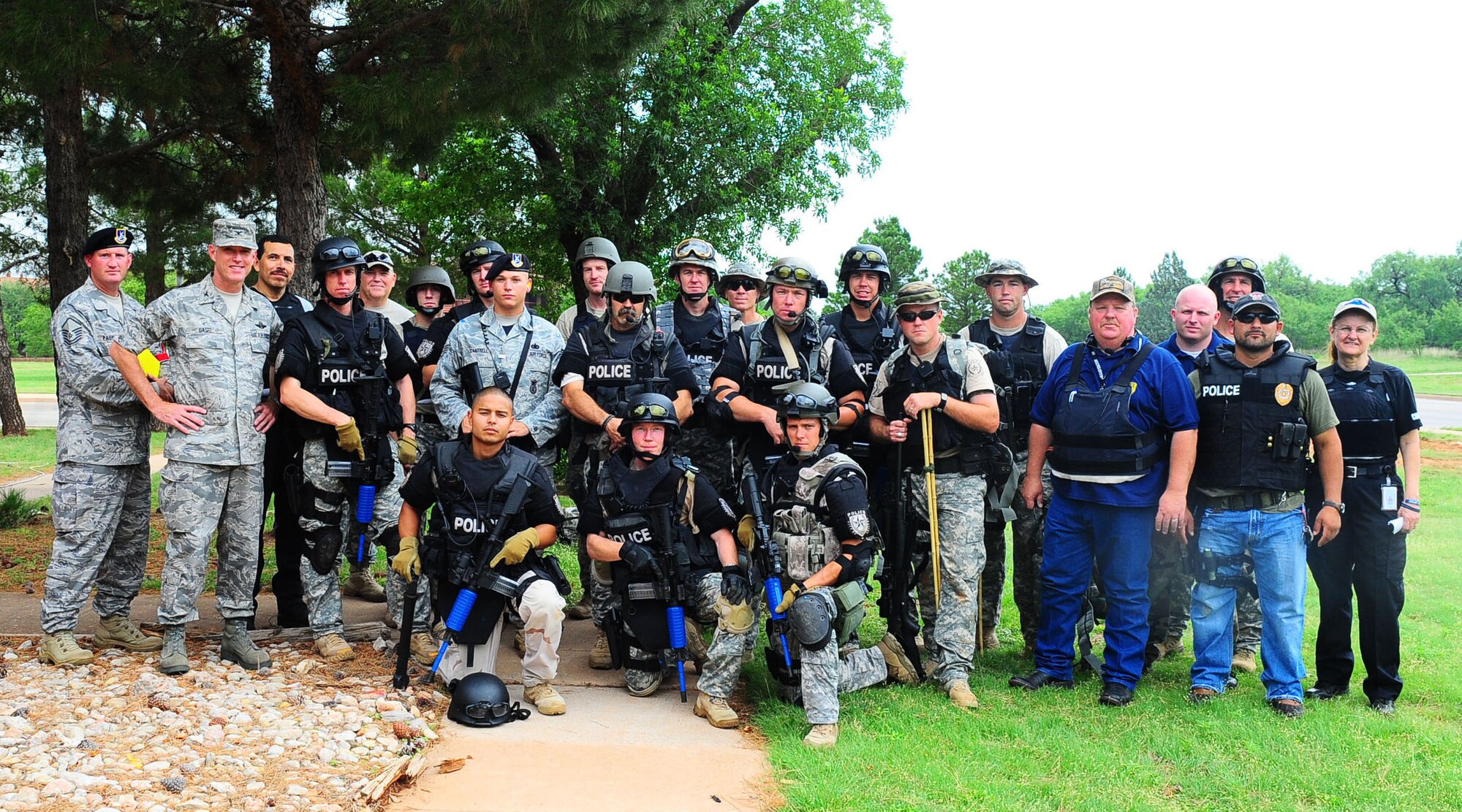 DYESS AIR FORCE BASE, Texas -- 7th Security Forces Squadron members, Abilene Police Department SWAT members and Col. Robert Gass, 7th Bomb Wing commander, pose for a photo after a joint exercise June 10 here. (U.S. Air Force photo by Senior Airman Domonique Washington)