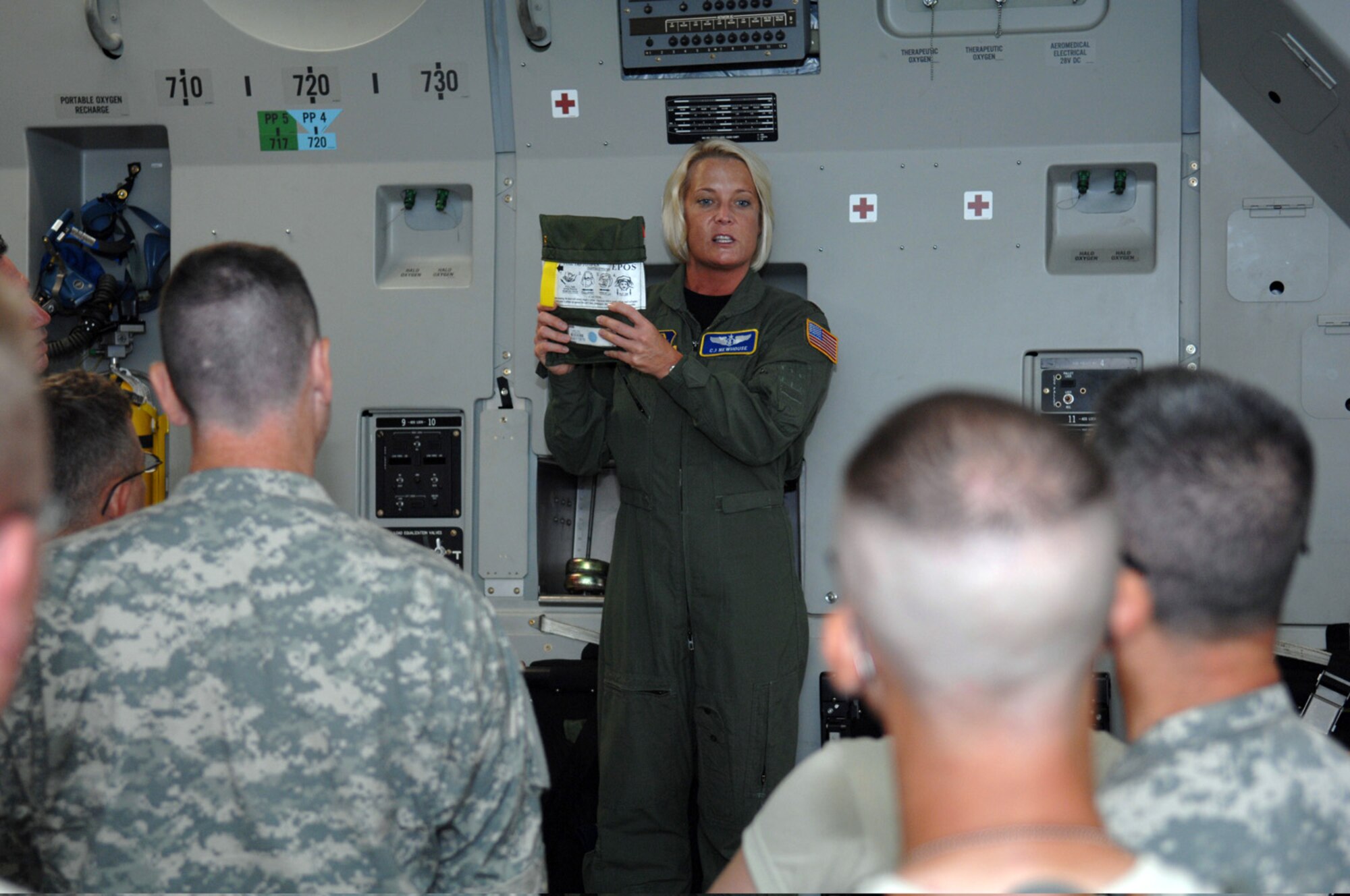 Maj. C. J. Newhouse, center, a flight nurse from the 446th Aeromedical Evacuation Squadron, McChord Air Force Base, Wash., briefs Army reservists from Wisconsin and Missouri on how to use an emergency passenger oxygen system aboard an Air Force C-17 Globemaster III cargo plane June 7, 2009, during medical exercise Global Medic 2009 at Bush Field, Ga. Global Medic is an annual medical exercise designed to replicate all aspects of combat service support on the battlefield and allows participating combat support units to train as they fight. As one of the largest medical command and control exercises between the U.S. Army and Air Force Reserve, Global Medic serves as an effective means to train medical units and staff for real-world missions. (U.S. Air Force photo/Senior Airman Erica Knight)
