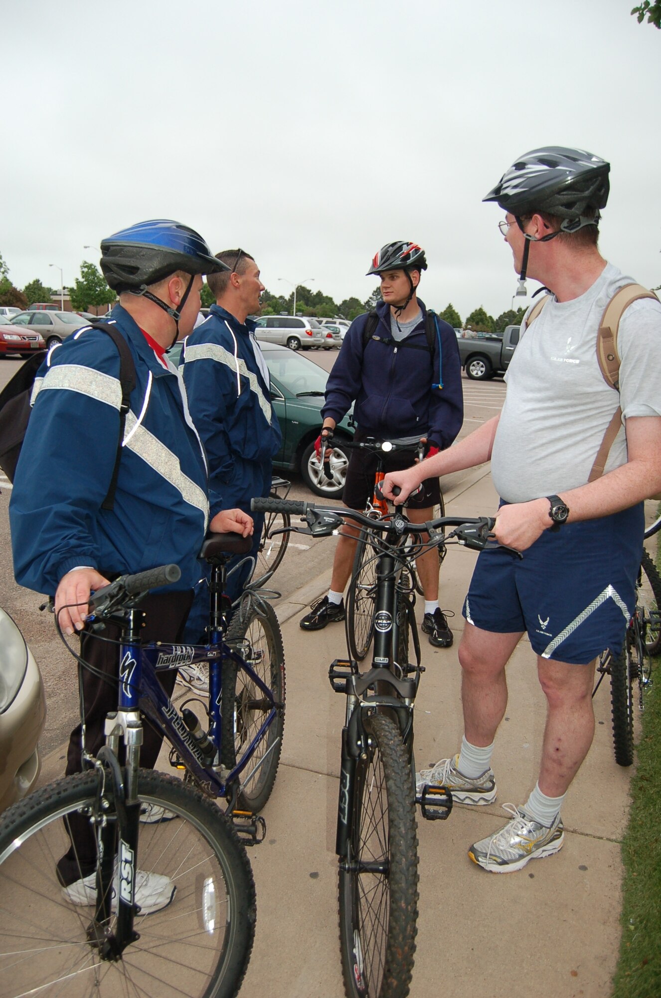 Bicyclists converse outside the Peterson Sports and Fitness Center after the scavenger hunt portion of the Bike to Work day Amazing Base Race June 10. About 30 bicyclists met at the Peterson Chapel in the early morning for a southwestern breakfast and the Amazing Base Race scavenger hunt that ended at the center. The Health and Wellness Center’s Bike Borrow program kicked-off the same day. Eight bikes are available through the Bike Borrow program at the HAWC for one day use. (U.S. Air Force photo by Thea Skinner)