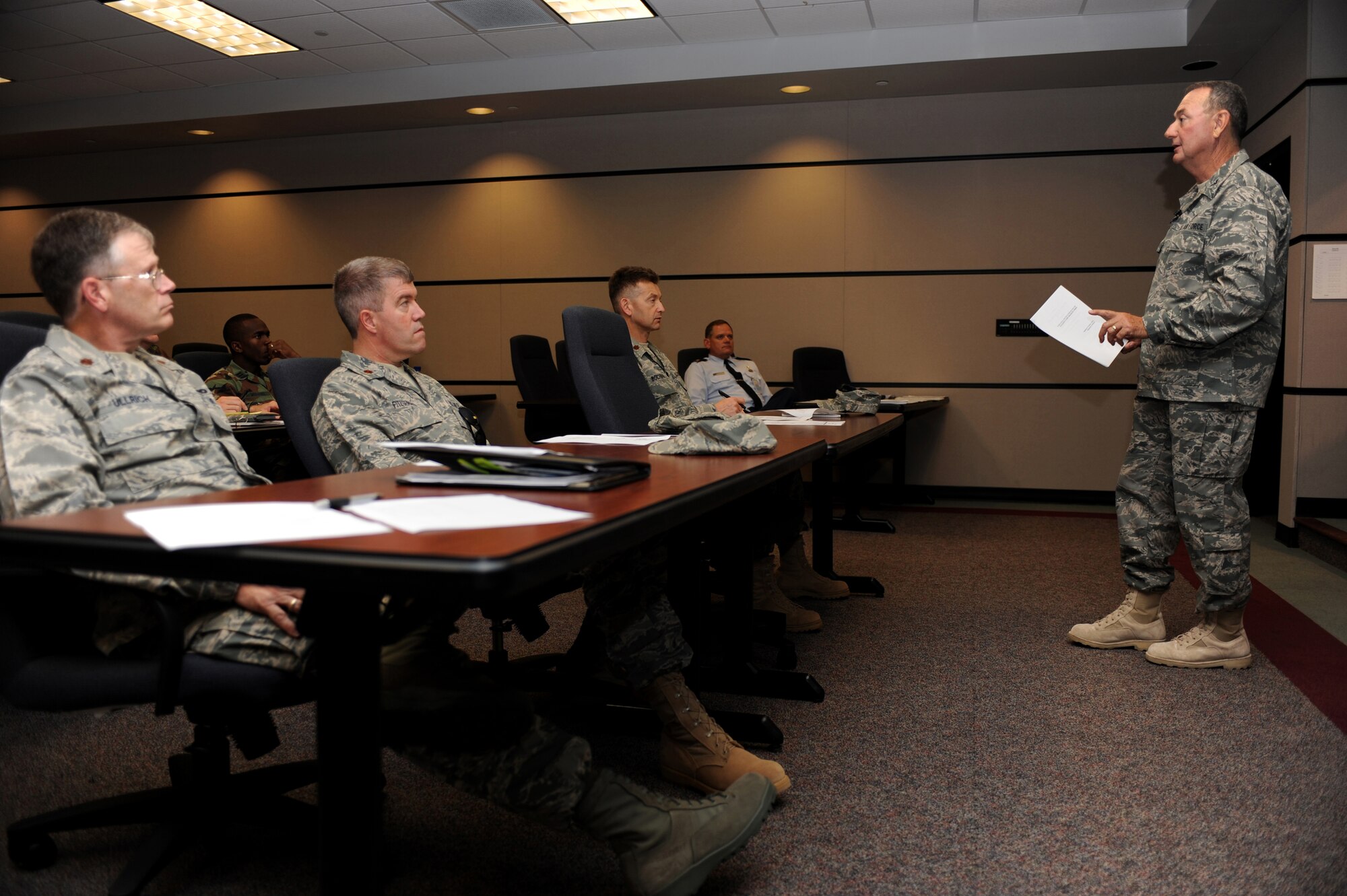 Chaplain (Col.) Charles Bolin, individual mobilization augmentee to the Air Force Reserve Command deputy command chaplain, briefs on traumatic stress response June 15 to students attending chaplain and chaplain assistant functional training at the U.S. Air Force Expeditionary Center on Joint Base McGuire-Dix-Lakehurst, N.J.  This course is required for all Chaplain Corps personnel who attend Advanced Contigency Skills Training taught by the 421st Combat Training Squadron.   (U.S. Air Force Photo/Staff Sgt. Nathan G. Bevier) 