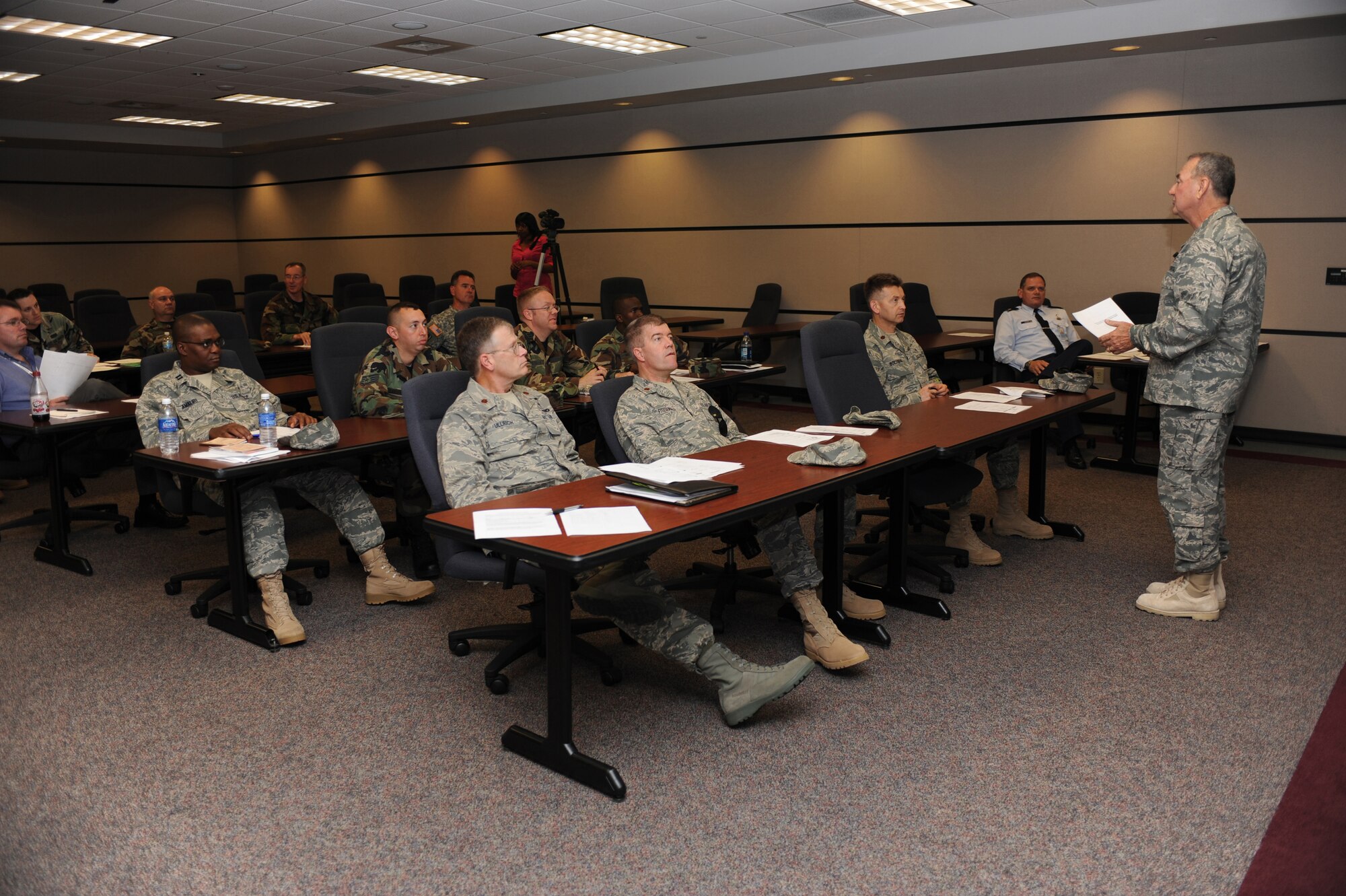 Chaplain (Col.) Charles Bolin, individual mobilization augmentee to the Air Force Reserve Command deputy command chaplain, briefs on traumatic stress response June 15 to students attending chaplain and chaplain assistant functional training at the U.S. Air Force Expeditionary Center on Joint Base McGuire-Dix-Lakehurst, N.J.  This course is required for all Chaplain Corps personnel who attend Advanced Contigency Skills Training taught by the 421st Combat Training Squadron.   (U.S. Air Force Photo/Staff Sgt. Nathan G. Bevier) 