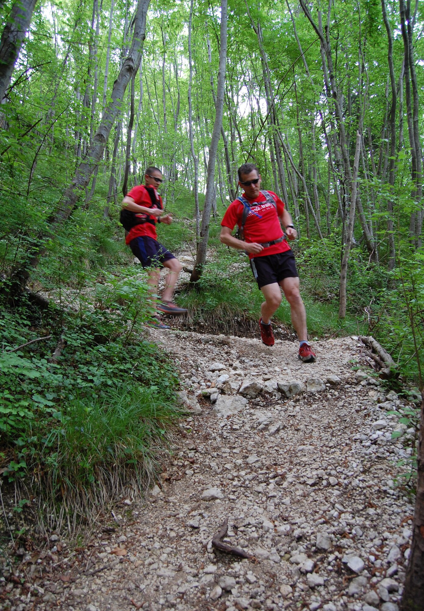 Jared Struck and Douglas Campfield run through trails in the "Prealpi" Dolomite mountain range north of Aviano as they train for the 9th Annual Le Grand Raid International du Cromagnon, a 34-mile extreme race through the Maritime Alps. The duo crossed the finish line on June 6 as 101 and 102 out of the 264 competitors. (U.S. Air Force photo/Staff Sgt. Lindsey Maurice)