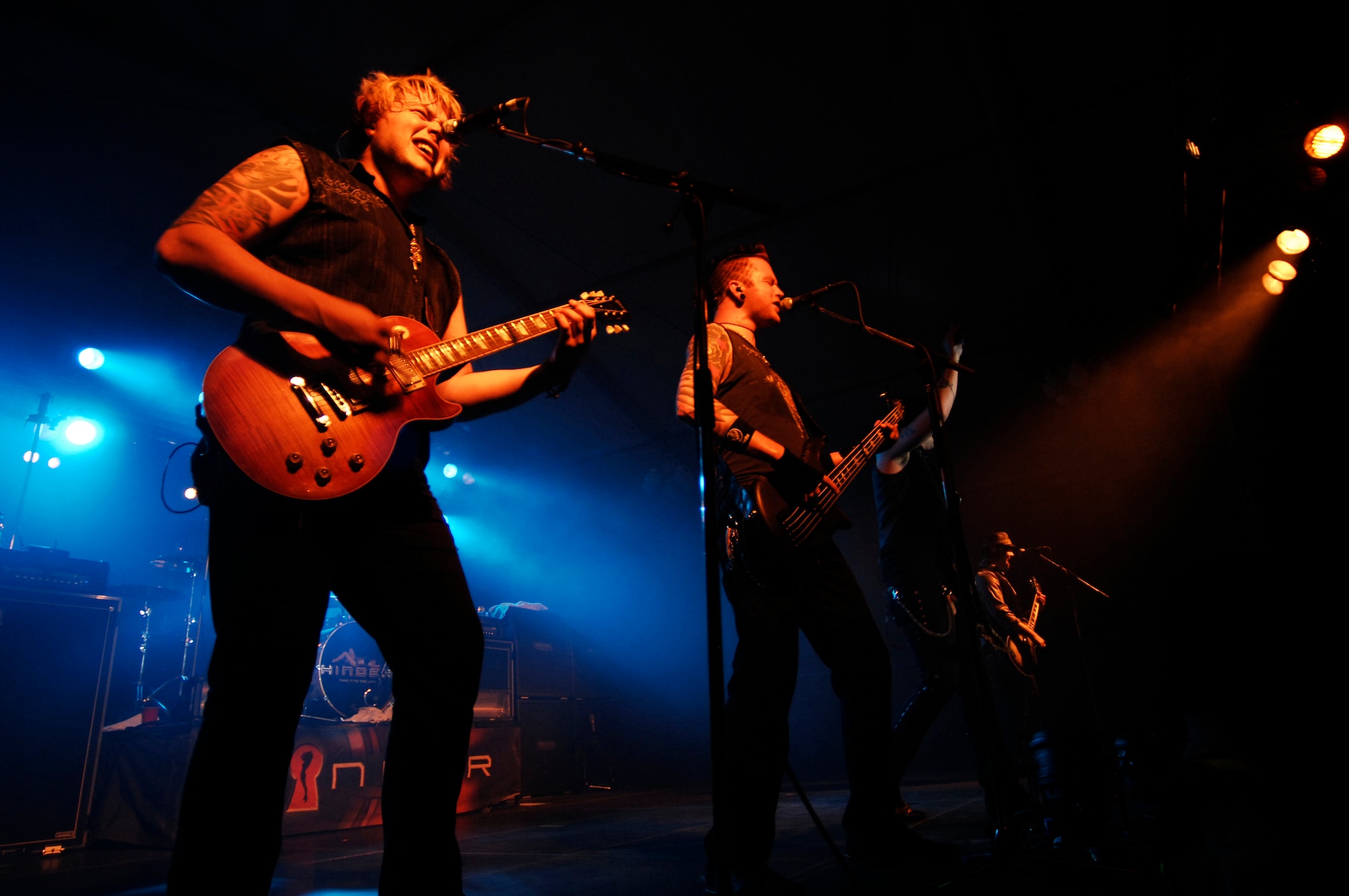 (left) Joe ‘Blower’ Garvey, lead guitarist for Hinder, and Mike Rodden, bass guitarist for Hinder, perform for servicemembers and their families, June 5, 2009, Ramstein Air Base, Germany. The Armed Forces Entertainment and Navy Entertainment indulged servicemembers overseas and at remote and isolated locations with entertainment to boost morale and welfare. (U.S. Air Force photo by Senior Airman Amber Bressler)