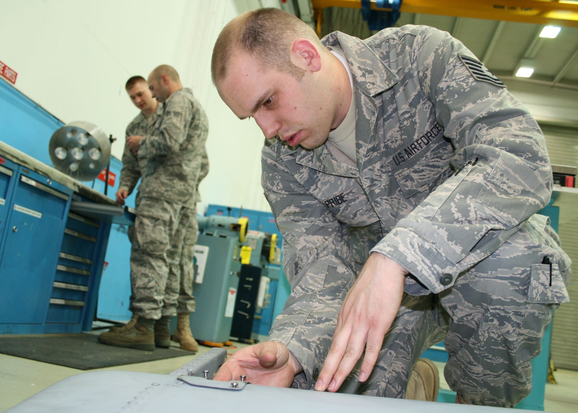 SPANGDAHLEM AIR BASE, Germany – Senior Airman Bryan Smith, 52nd Equipment Maintenance Squadron, assesses the weight of an A-10 rudder June 9. The evaluation must be performed because it is essential that flight controls are balanced. (U.S. Air Force photo by Airman 1st Class Nicholas Wilson)