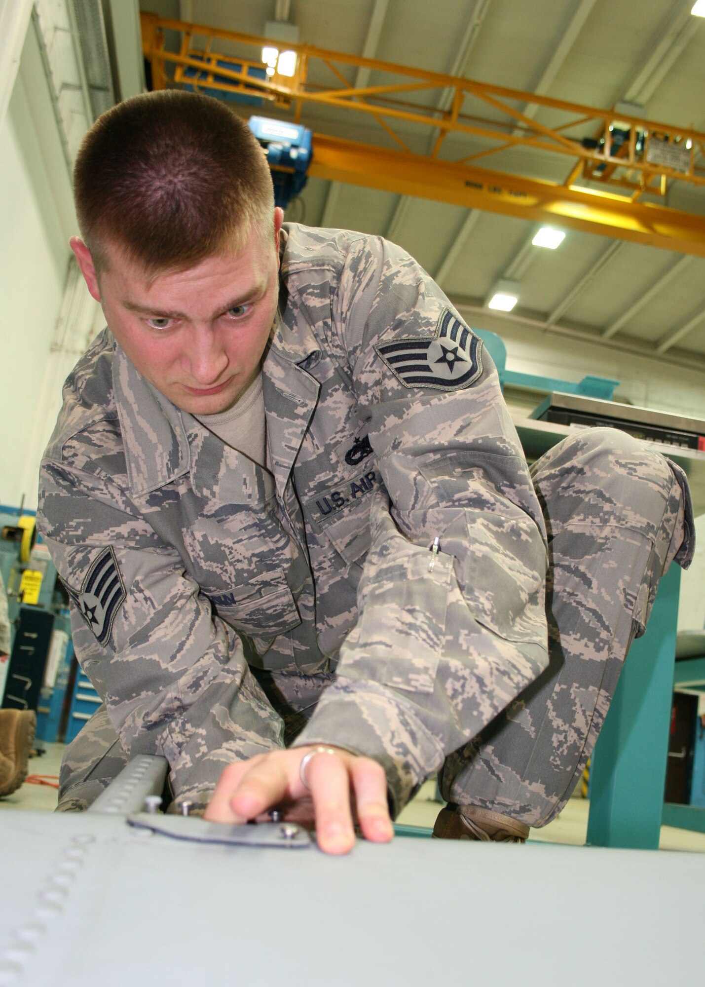 SPANGDAHLEM AIR BASE, Germany – Staff Sgt. Donald Penn, 52nd Equipment Maintenance Squadron, measures an A-10 rudder’s weight June 9. To make sure that flight controls are balanced, the evaluation must be performed. (U.S. Air Force photo by Airman 1st Class Nicholas Wilson)