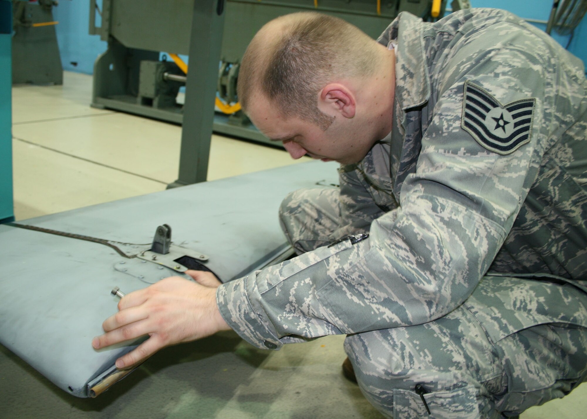 SPANGDAHLEM AIR BASE, Germany –Tech. Sgt. Brad Pribe, 52nd Equipment Maintenance Squadron, evaluates the weight of an A-10 rudder June 9. This is done to maintain balance of flight controls within the aircraft. (U.S. Air Force photo by Airman 1st Class Nicholas Wilson)