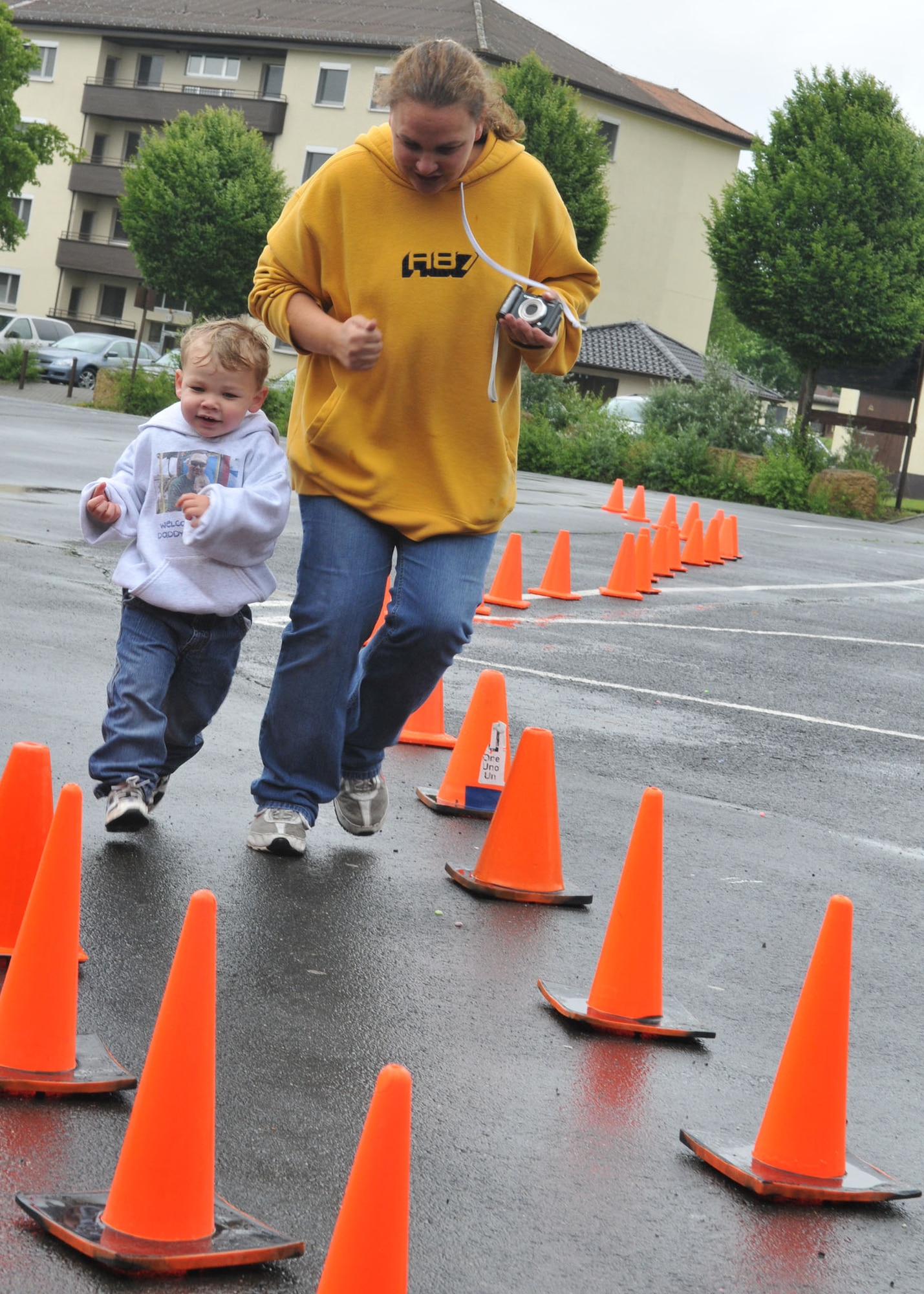SPANGDAHLEM AIR BASE, Germany –Lisa and Timothy Albert scamper to the finish line of the “Race into Summer” at Bitburg Middle School June 11. Mrs. Albert and Timothy participated in support of Madison Albert, a fifth grader at Bitburg Middle School. Madison finished the race in 10 minutes and 8 seconds. (U.S. Air force photo by Airman 1st Class Nick Wilson)