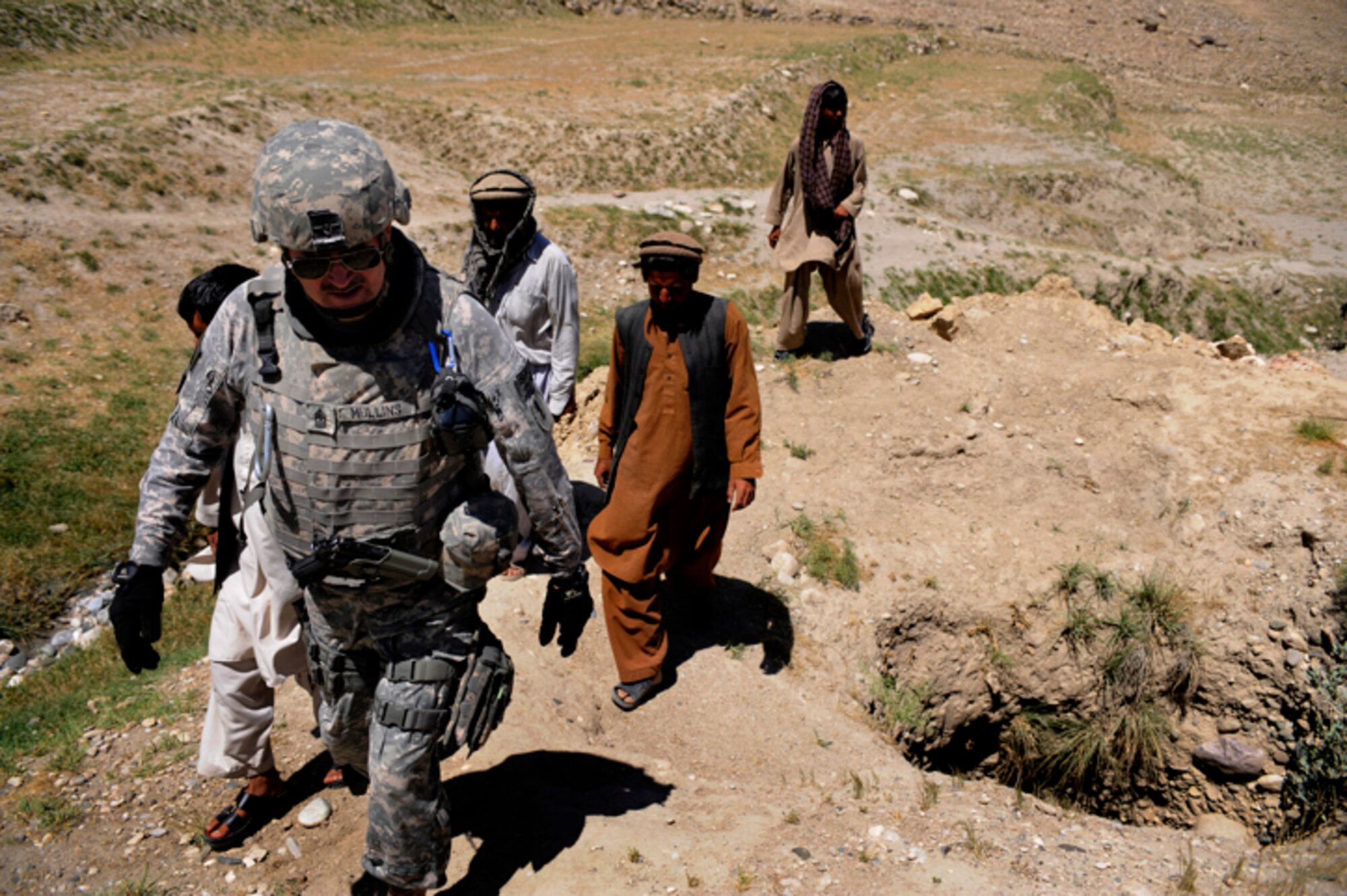 U.S. Army Sergeant  Major Matthew Mullins, Nangarhar Agri-Business Development Team Chief, Forward Operating Base  Finley-Sheilds, Nangarhar Province conducts a site survey at a karize site in Rodat, Afghanistan, May 28. The Nangarhar Agri-Business Development Team is responsible for developing and monitoring projects which will improve the agricultural production of the rural farming communities in the province. The team supports the construction of wells, karizes, veterinary clinics, and reforestation projects. Sergeant Major Mullins is the 70th Troop Command sergeant major at Missouri Joint Task Headquarters, Missouri National Guard.