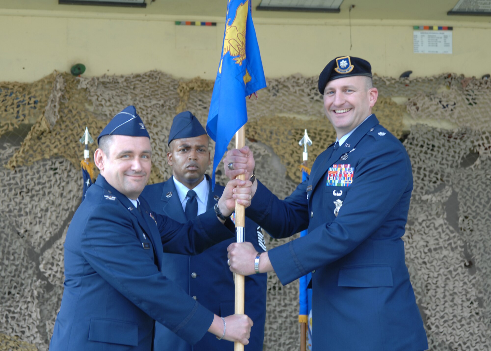 Col. Andrew Pears, 39th Mission Support Group commander, passes the guidon to the new 39th Security Forces Squadron commander, Lt. Col. Glen Christensen, during the change of command ceremony Monday, June 15, 2009, Incirlik Air Base, Turkey. The passing of the guidon is a time honored tradition symbolizing the acceptance of command in the Air Force. Colonel Christensen was the commander, 50th Security Forces Squadron, Schriever AFB, Colorado prior to his permanent change of station. (U.S. Air Force photo/Staff Sgt. Lauren Padden)