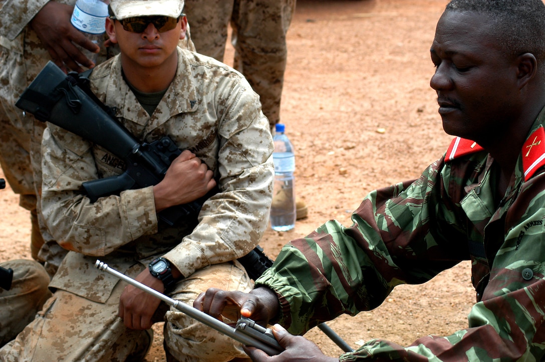 Beninese army 1st Sgt. Marcellin Sinzogan, right, teaches U.S. Marines ...