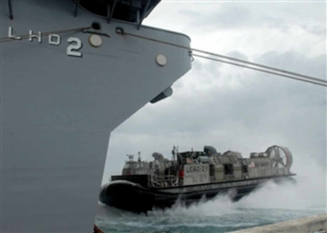 Landing craft air cushion 21, also known as an LCAC, from Detachment Western Pacific Assault Craft Unit 5, enters the well deck of the amphibious assault ship USS Essex (LHD 2) while in port in Yokosuka, Japan, on June 14, 2009.  U.S. Marines with the 31st Marine Expeditionary Unit are boarding the Essex in preparation to deploy for Talisman Sabre 2009, which is a biennial, joint, combined exercise sponsored by U.S. Pacific Command and the Australian Defense Force that focuses on the planning and execution of contingency response operations.  