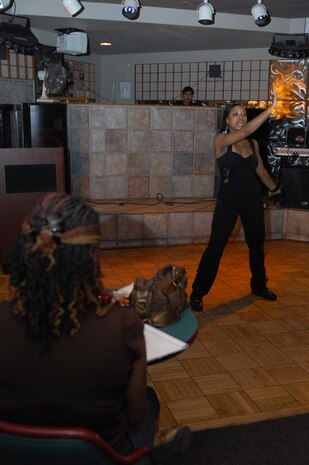 NELLIS AIR FORCE BASE, Nev. -- Airman 1st Class Ashley Banks, a food service apprentice with the 99th Force Support Squadron, performs a dance routine during the African American Cultural Association (AACA) sponsored Open Mic Night here, June 16.  The AACA Open Mic Night is to open to all and is featured every third Tuesday of the month from 7 to 9 p.m. at the Desert Oasis Enlisted Club 
(U.S. Air Force photo by Staff Sgt. Taylor Worley)