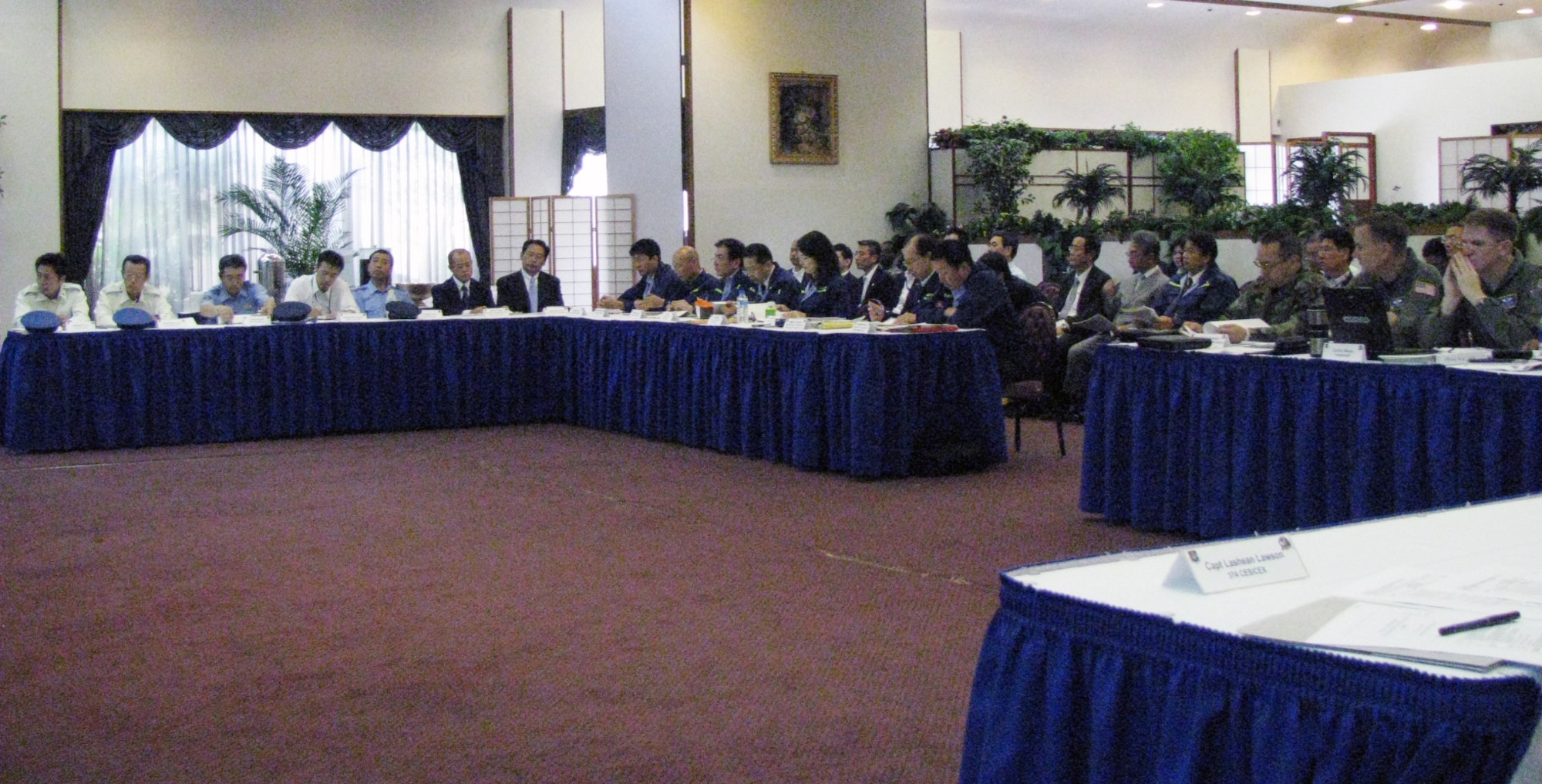 YOKOTA AIR BASE, Japan -- More than 100 representatives from Yokota Air Base, the North Kanto Defense Bureau and the city governments of Tokyo and Fussa, discuss a coordinated response to a simulated major aircraft accident in the local area June 16 at the officers' club. (U.S. Air Force photo/Masao Abe)
 
