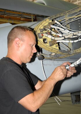 Following installation of the AAR-47 infrared missile warning system, 124th Maintenance Squadron electrician Master Sgt. Scott Johnson conducts a continuity check to ensure the system is running properly.  The Idaho Air National Guard based at Gowen Field, Boise, Idaho, has employed 45 maintainers full-time for at least one year to perform this assembly line-style Consolidated Install Program on roughly one third of the Air Force's A-10 Thunderbolt II fleet. (Air Force photo by Master Sgt Tom Gloeckle)(Released)