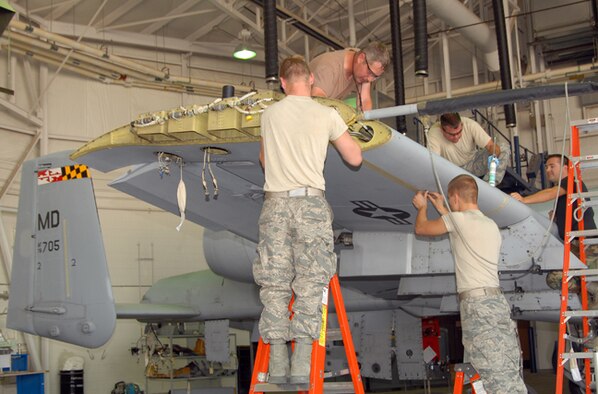 A team of Idaho Air National Guard maintainers from the 124th Wing at Gowen Field in Boise, Idaho reinstall the leading edges on the wing of a Maryland Air National Guard A-10 Thunderbolt II.  The aircraft received a new AAR-47 infrared missile warning system as part of the A-10 Consolidated Install Program June 16.
(Air Force photo by Master Sgt Tom Gloeckle)(Released)
