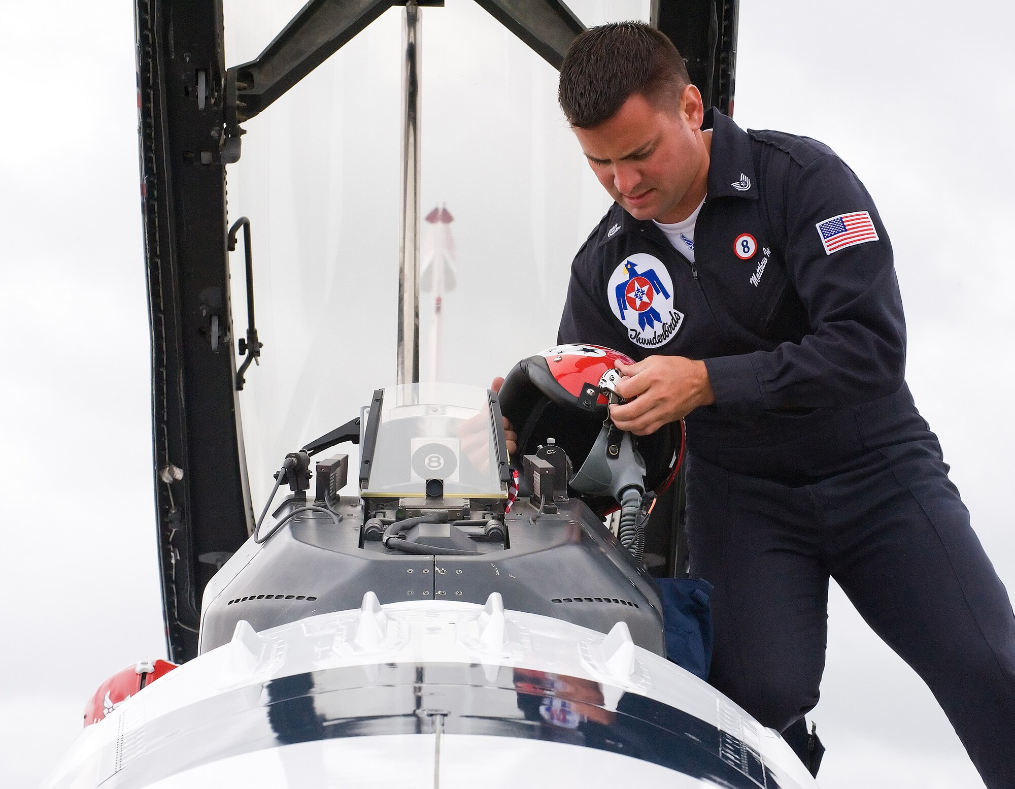 Tech. Sgt. Matthew Inman examines the flight helmet for Thunderbird #8 at Dover Air Force Base June 17. The advance pilot for the Thunderbirds arrived at Dover to ensure the base was ready before the rest of the Air Force’s premier Aerial Demonstration Squadron arrives June 18.  (U.S. Air Force photo/Tom Randle)