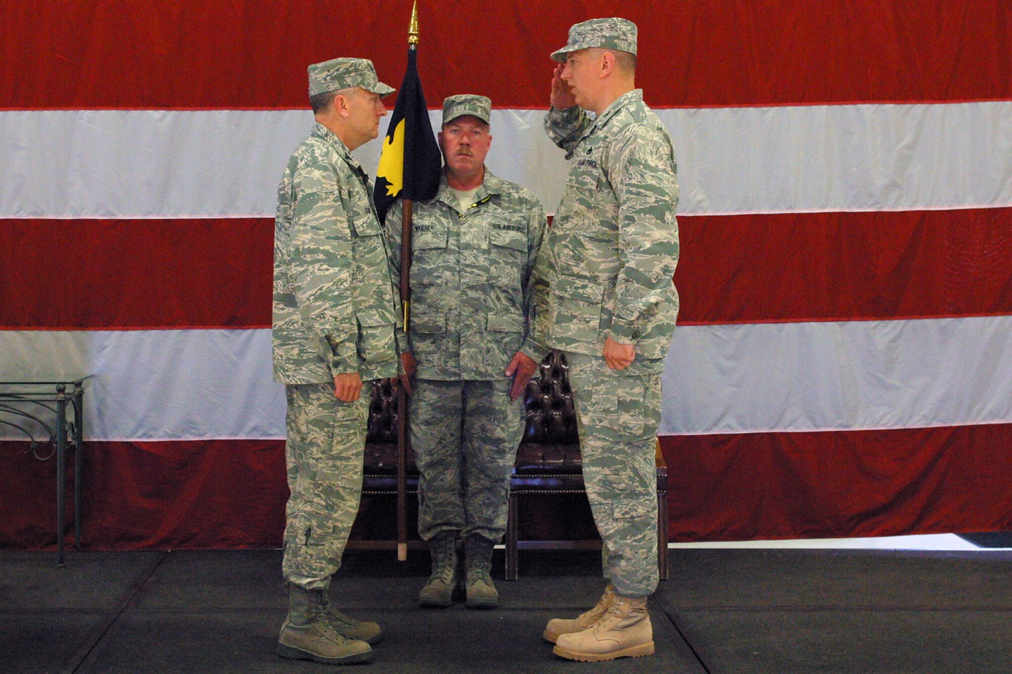 Col. Stan Sheley, the new 419th Maintenance Group commander, salutes Col. Walter “Buck” Sams, 419th Fighter Wing commander, at his assumption of command on June 14. (U.S.  Air Force photo/Staff Sgt.  Kyle Brasier)