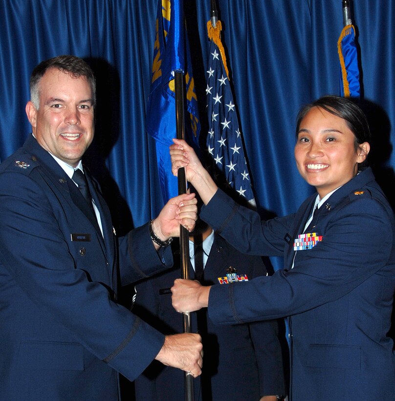 Maj. Tina Nguyen, right, accepts command of the 71st Comptroller-Contracting Squadron from Col. Richard Murphy, 71st Flying Training Wing vice commander, during a ceremony held June 12 at the Vance Collocated Club. Major Nguyen comes to Vance from Randolph AFB, Texas, where she served as the chief of Air Education and Training Command’s account and funds control. She replaced Maj. Neal Monroe who was reassigned to Osan AB, Korea. (U.S. Air Force photo/Chad Chambers)