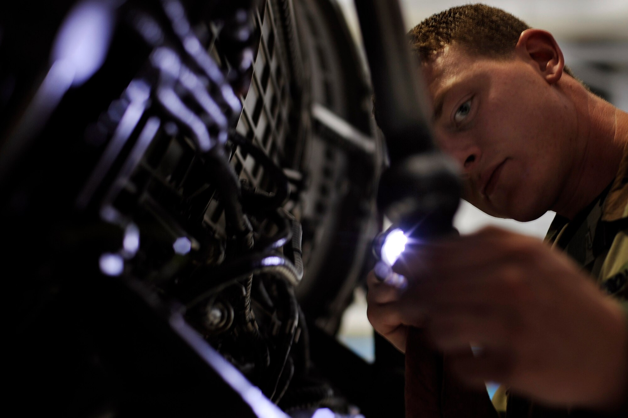 Senior Airman Nicholas Tester, 28th Aircraft Maintenance Squadron aerospace maintenance journeyman, performs an isochronal inspection on a B-1B Lancer's turbofan engine here, June 16. The average time to complete an isochronal inspection on a B-1B Lancer is 15 days. (U.S. Air Force photo by Airman 1st Class Corey Hook)