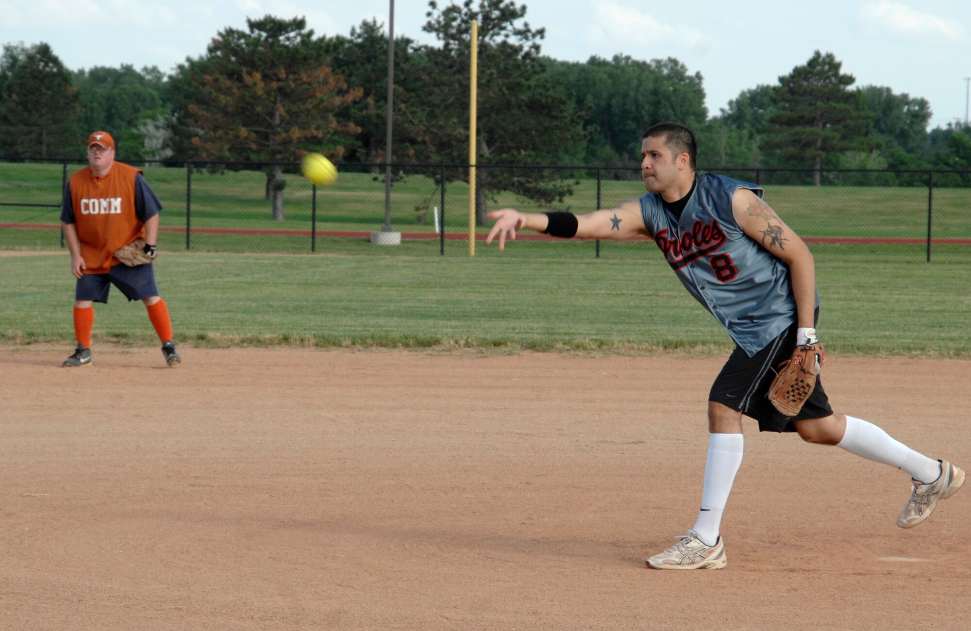 MCCONNELL AIR FORCE BASE, Kan. -- Staff Sgt David Wilson, 22nd Communications Squadron, pitches softball for the CS intramural team during a game against the 22nd Logistics Readiness Squadron at the base’s softball field, June 11. Each squadron on base is given the opportunity to form a team for seasonal intramural sports including softball, volleyball, and basketball. (Photo by Senior Airman Laura Suttles)