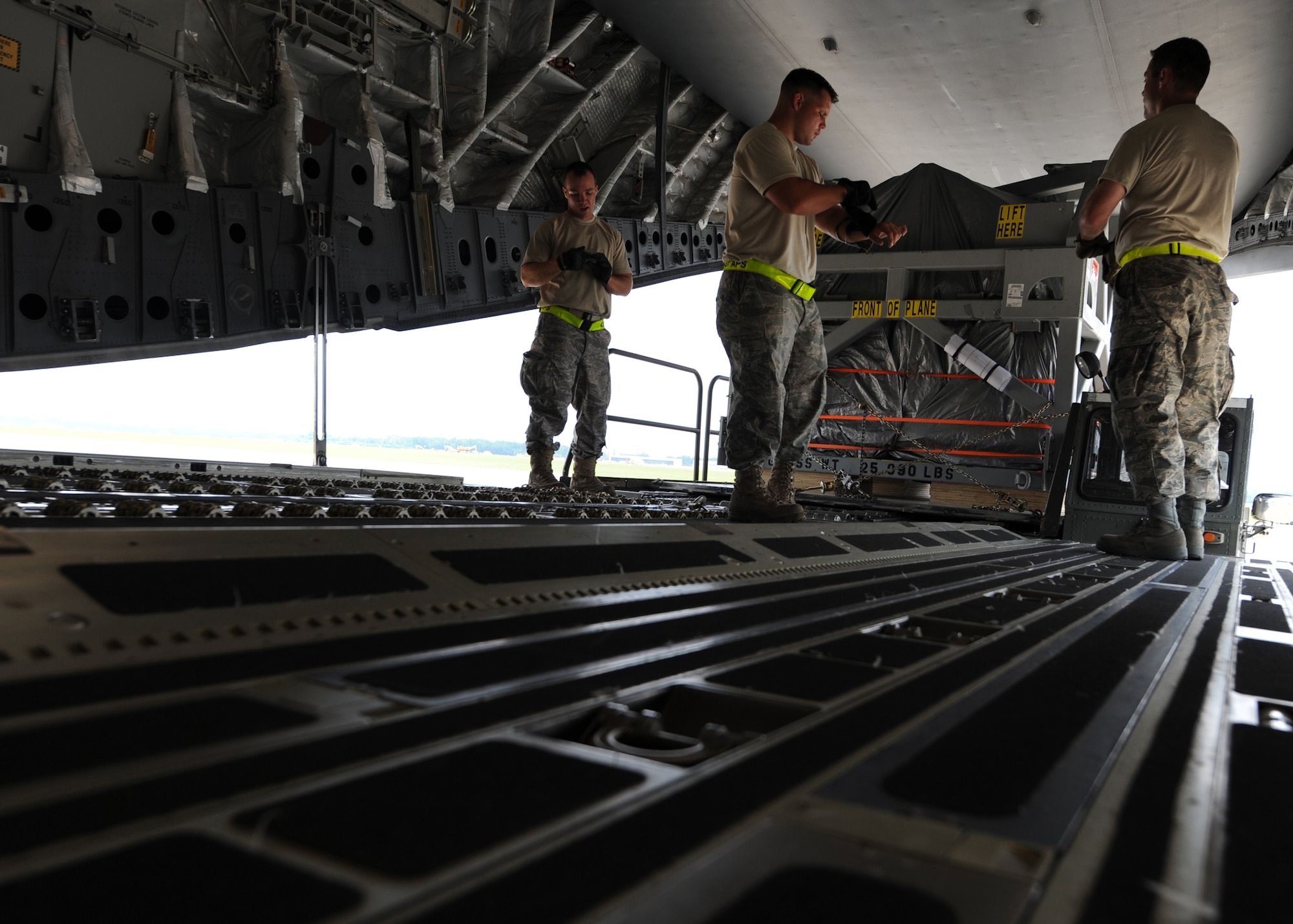 Airmen prepare to load a magnetic resonance imaging machine onto a C-17 here June 17. The MRI equipment was donated  by Washington University's School of Medicine in St. Louis to a hospital in Salta, Argentina. The Airmen are members of a load team with 437th Aerial Port Squadron. (U.S. Air Force photo/Senior Airman Katie Gieratz)

