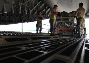 Airmen prepare to load a magnetic resonance imaging machine onto a C-17 here June 17. The MRI equipment was donated  by Washington University's School of Medicine in St. Louis to a hospital in Salta, Argentina. The Airmen are members of a load team with 437th Aerial Port Squadron. (U.S. Air Force photo/Senior Airman Katie Gieratz)

