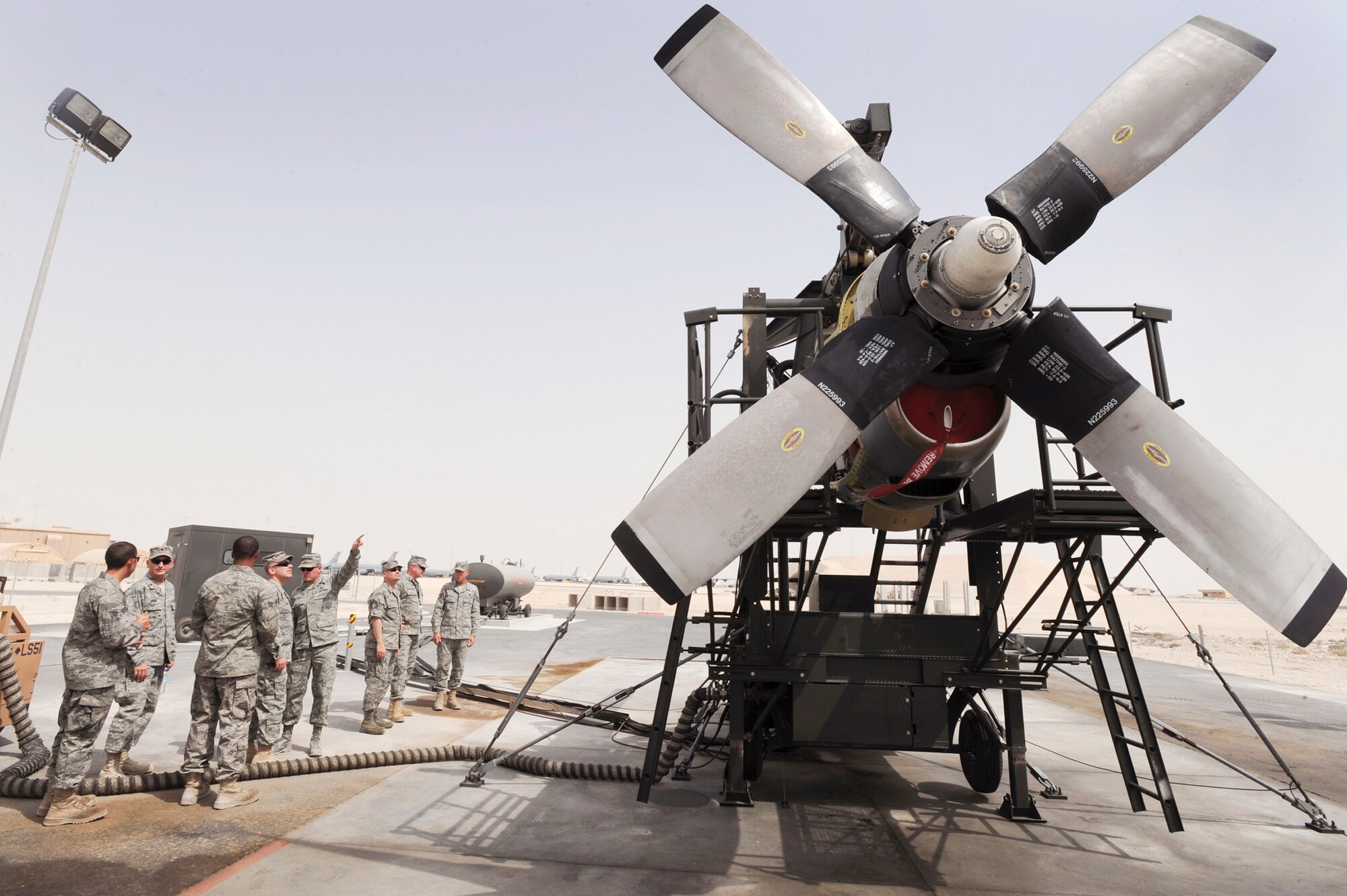 Senior maintainers from the 379th Expeditionary Maintenance Group at an air base in Southwest Asia get briefed on the new T56 engine test cell June 14 prior to a demonstration of its capability.  This is the only T56 test cell in the U.S. Central Command area of responsibility.  The T56 enables maintainers to test engines in the AOR instead of sending them back to Ramstein Air Base, Germany.  (U.S. Air Force photo/Staff Sgt. Joshua Garcia)