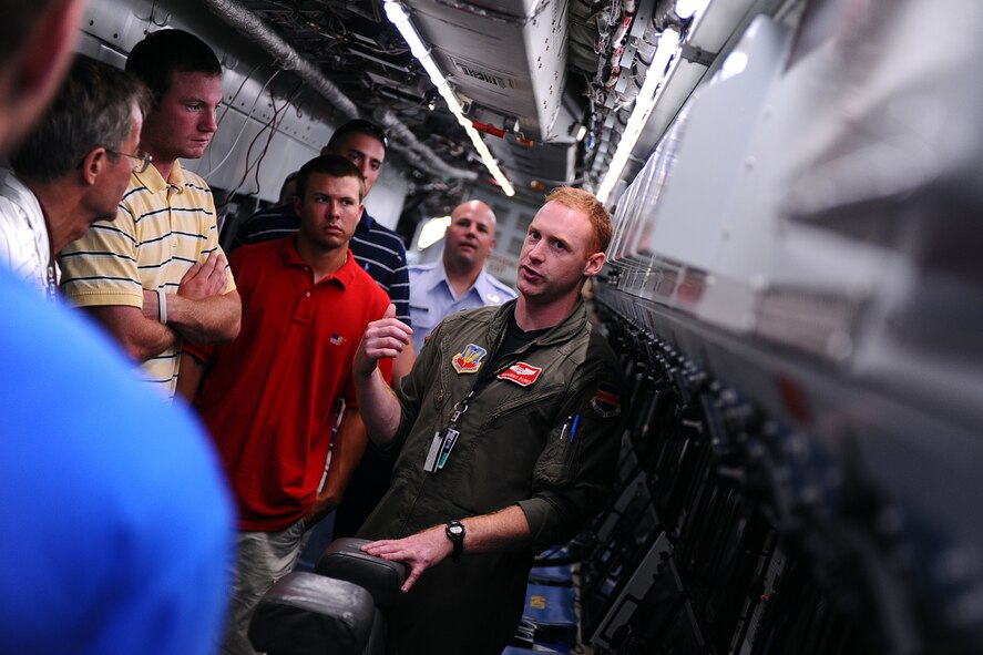 OFFUTT AIR FORCE BASE Neb.,-- 1Lt Anthony Purdy, 343rd Reconnaissance Squadron, gives a tour of an RC-135V/W Rivet Joint, a reconnaissance platform, located on the parking ramp here as part of a base tour where members of the Tar heels got an inside look at the mission of the 55th Wing, 15 June.  The Tar Heels baseball team is competing in the NCAA College World Series hosted at Omaha's Rosenblatt Stadium June 13-23/24.U.S. Air Force Photo by Josh Plueger