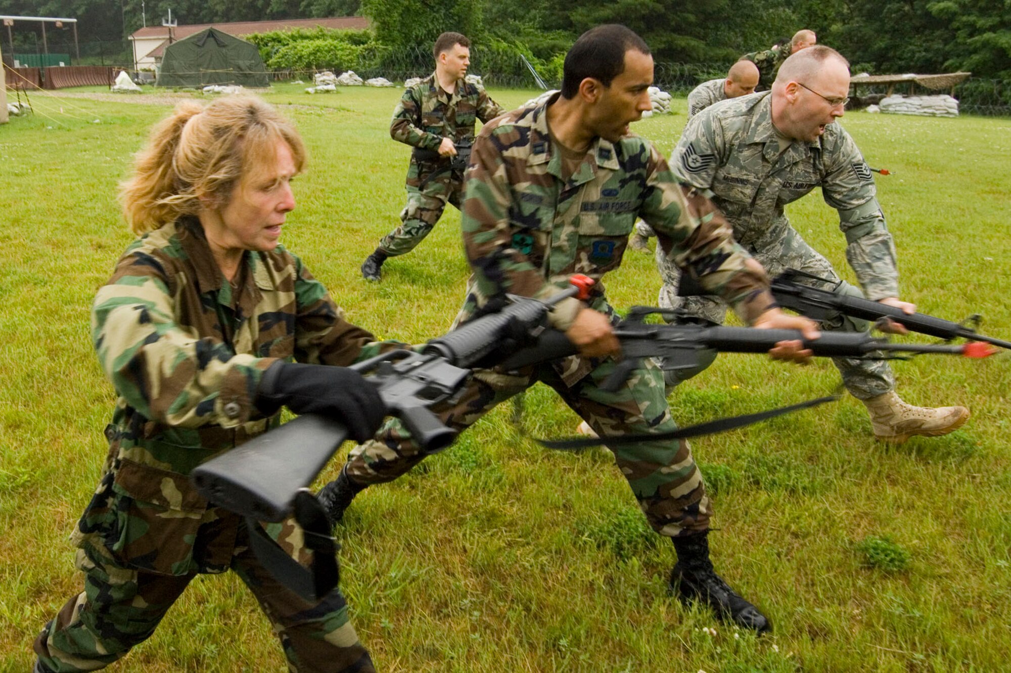 EACS students perform an M-16 maneuver during rifle fighting training at Camp Patriot June 12. Rifle fighting training prepares Airmen to utilize M-16 rifles in situations where deadly force would be either inappropriate or unmanageable due to weapon malfunction or close enemy proximity.  (U.S. Air Force photo by Rick Berry)