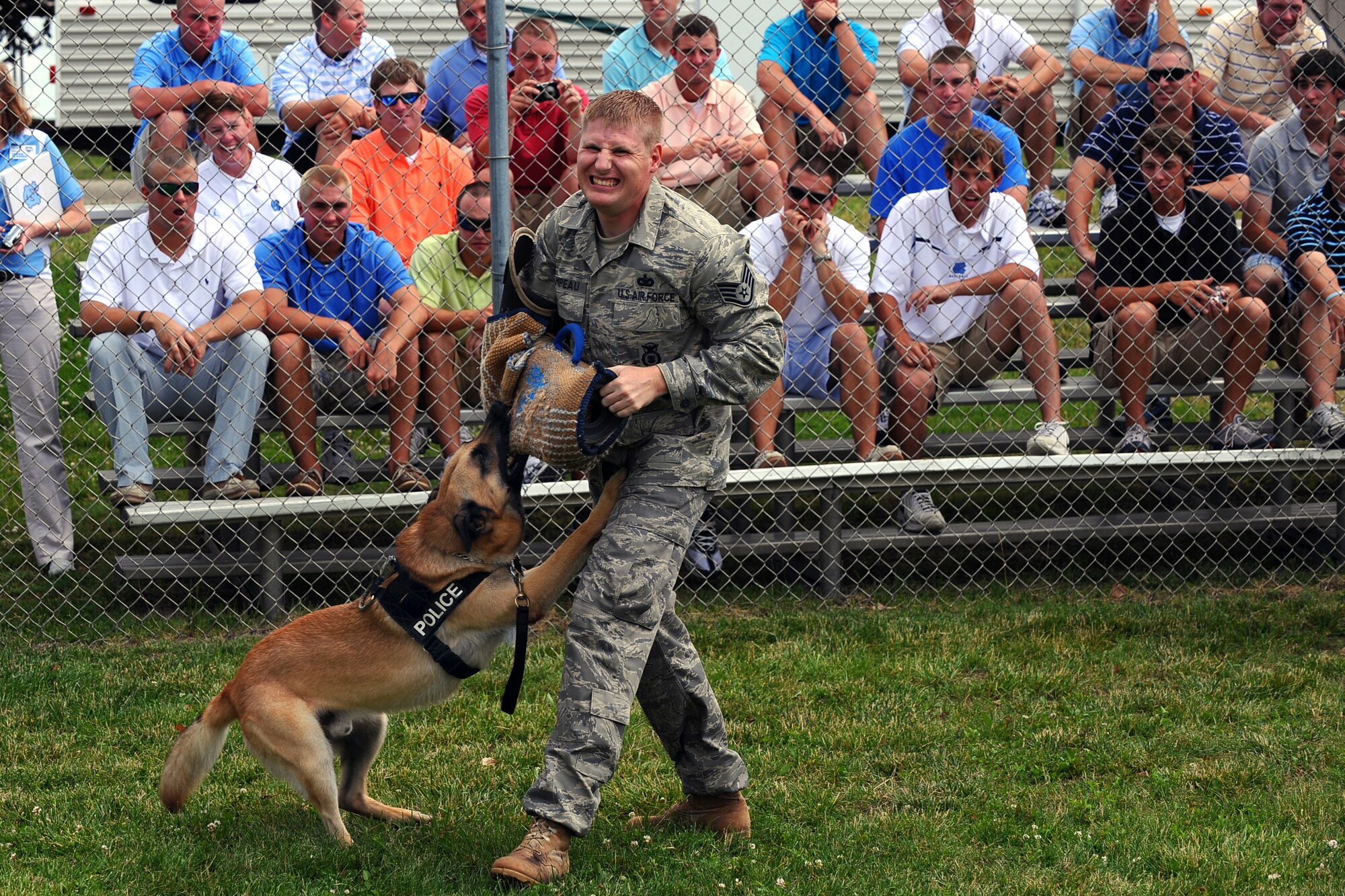 OFFUTT AIR FORCE BASE Neb.,--  Staff Sgt Grant Champeau, 55th Security Forces Squadron, gives a military working dog demonstration to the visiting University of North Carolina Baseball team as part of a base tour where members of the Tar heels got an inside look at the mission of the 55th Wing, 15 June.  The Tar Heels baseball team is competing in the NCAA College World Series hosted at Omaha's Rosenblatt Stadium June 13-23/24.

U.S. Air Force Photo by Josh Plueger