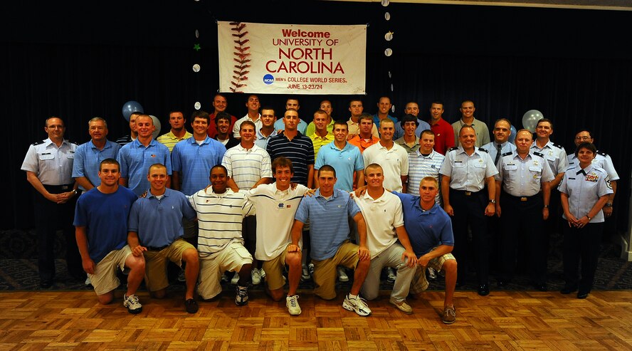OFFUTT AIR FORCE BASE Neb.,-- Baseball Players from the University of North Carolina, take a team photo with 55th Wing Leadership as part of a base tour where members of the Tar heels got an inside look at the mission of the 55th Wing, 15 June.  The Tar Heels baseball team is competing in the NCAA College World Series hosted at Omaha's Rosenblatt Stadium June 13-23/24.U.S. Air Force Photo by Josh Plueger