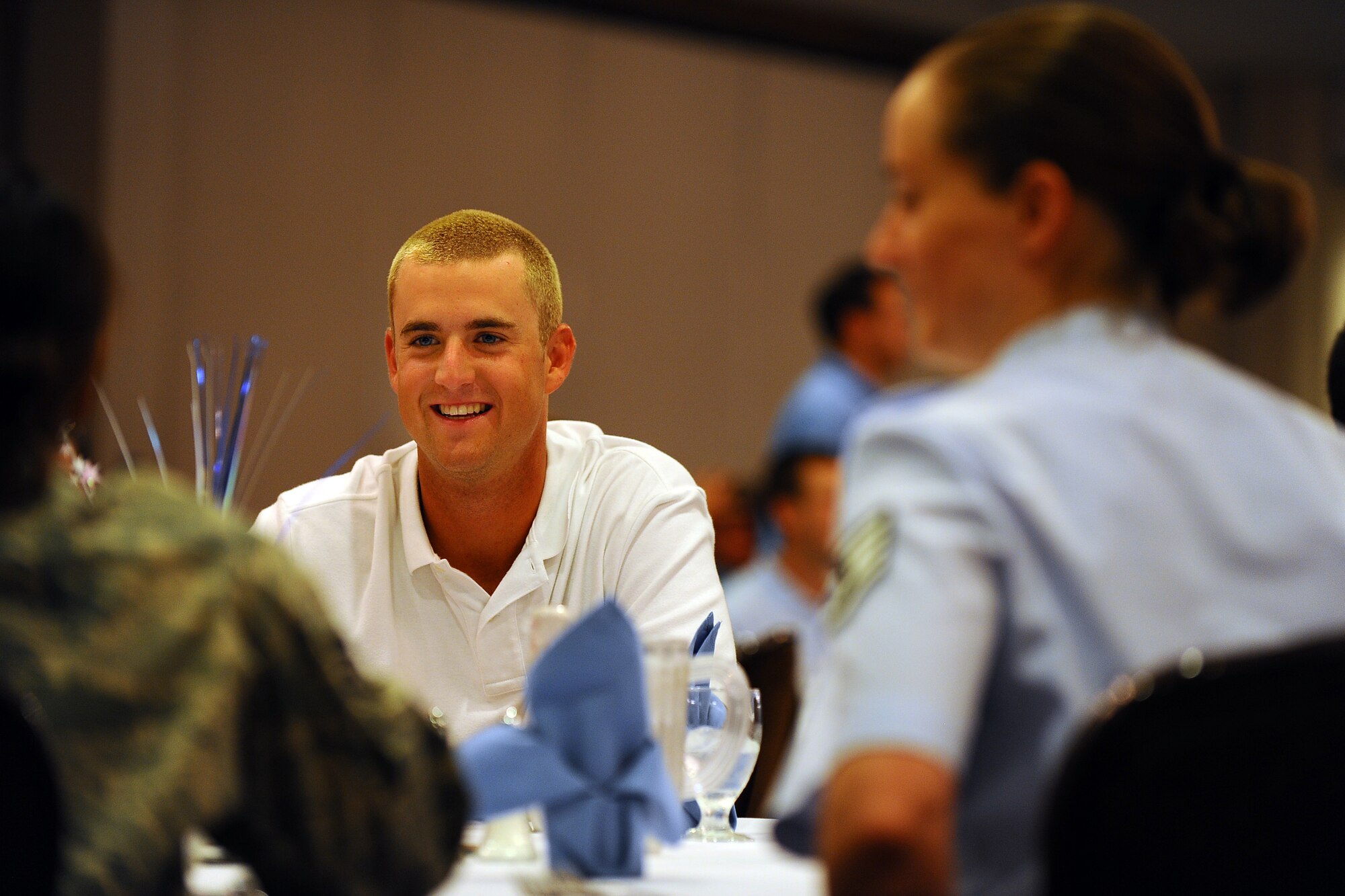 OFFUTT AIR FORCE BASE Neb.,-- Utility player Greg Holt, University of North Carolina Baseball, sits down with members of team Offutt for a lunch at the Patriot Club as part of a base tour where members of the Tar heels got an inside look at the mission of the 55th Wing, 15 June.  The Tar Heels baseball team is competing in the NCAA College World Series hosted at Omaha's Rosenblatt Stadium June 13-23/24.

U.S. Air Force Photo by Josh Plueger
