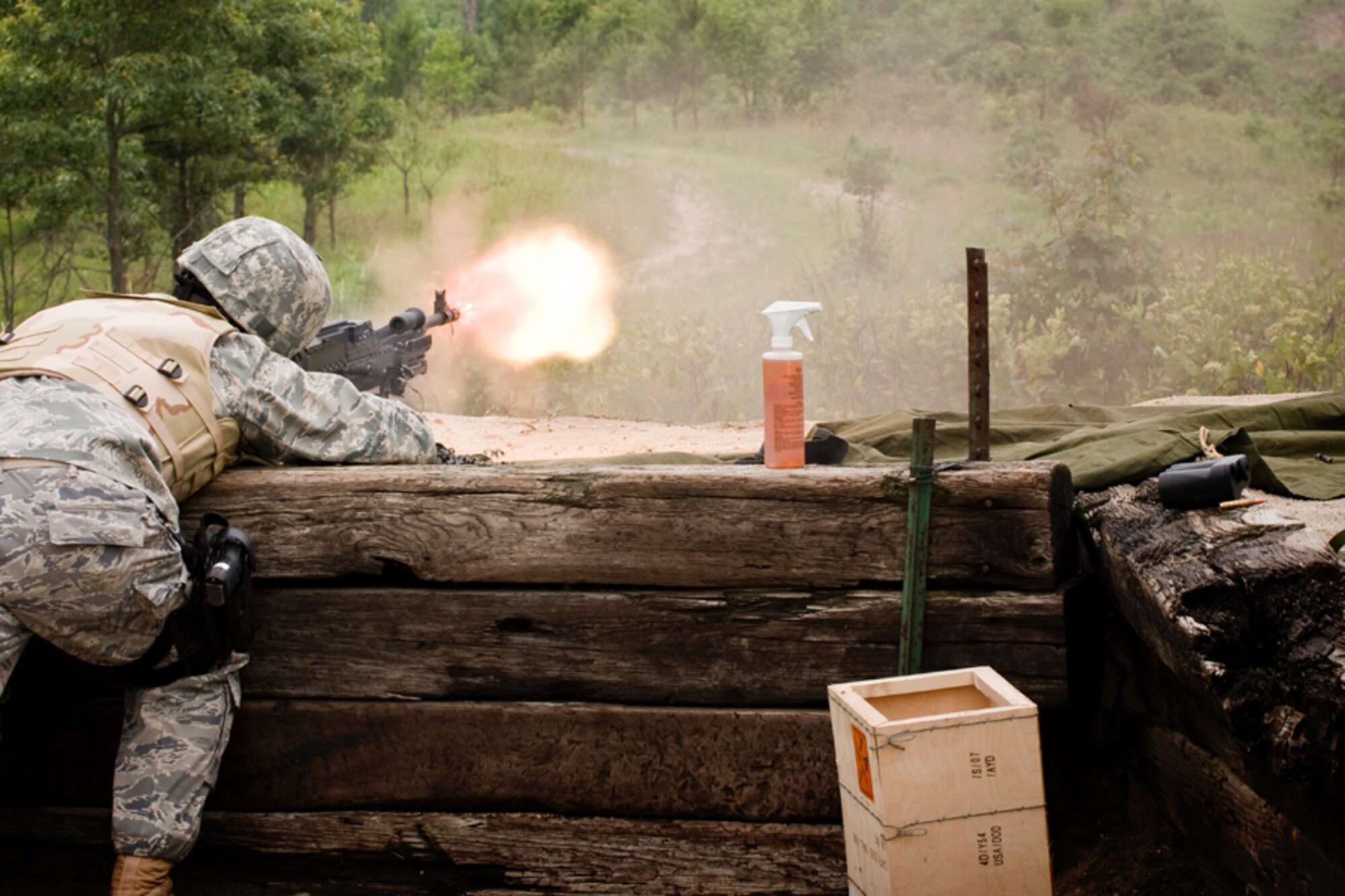 Staff Sgt. Matthew Chase fires a long burst of 7.62mm ammunition from the M240 heavy machine gun. Each year, members of the 459th Security Forces Squadron are required to fire 1,100 rounds from both the M240 and M249. (U.S. Air Force Photo/ Capt. Nick Strocchia)