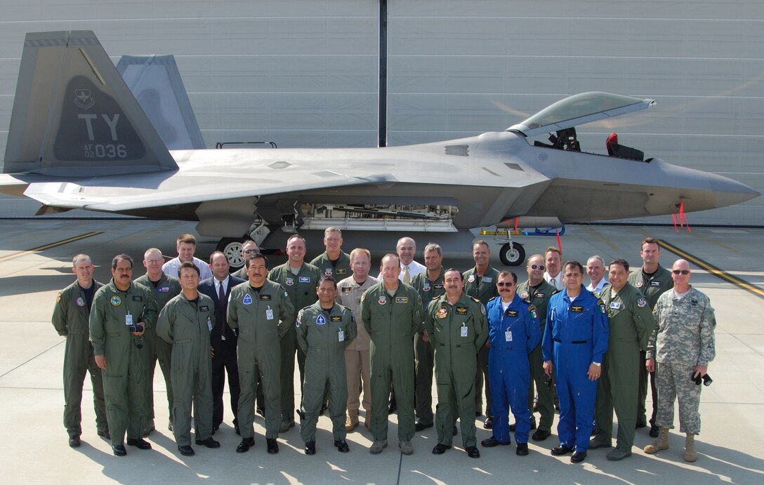 North American Air Chiefs Conference attendees pose in front of an F-22
Raptor from the 43rd Fighter Squadron at Tyndall AFB, Fla., where military
and civilian officials from Mexico, Canada and across the United States met
to discuss mutual homeland security operations.

