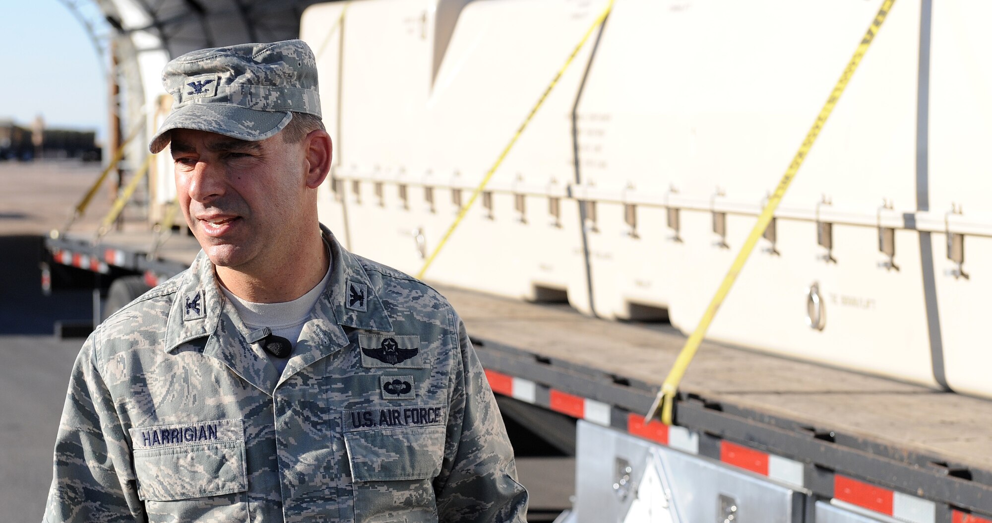 Col. Jeff Harrigian, 49th Fighter Wing commander, stands by the semi-truck containing the first unmanned aircraft system (UAS) to arrive at Holloman Air Force Base, N.M., June 16. The Predator is part of a UAS program which is currently housed temporarily at Holloman pending an announcement on the official location of the second UAS Formal Training Unit. (U.S. Air Force photo/Senior Airman Michael Means)