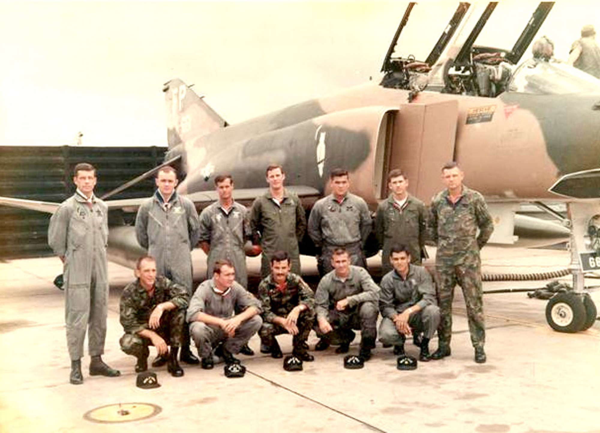 Group photograph of Wolf FACs of 8th Tactical Fighter Wing Ubon Royal Thai AB in June 1968. Drawn from the four squadrons assigned to the wing, these pilots volunteered for the Fast FAC missions. The F-4 is from the 497th Tactical Fighter Squadron, and the squadron’s “Night Owl” symbol is just behind the air inlet. (U.S. Air Force photo)