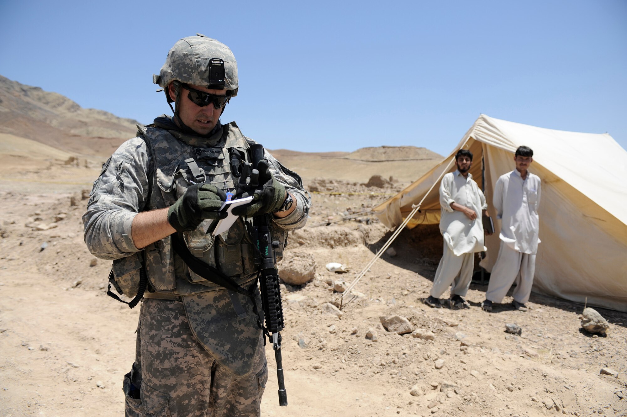 Tech. Sgt. Bryan Calaman, Nangarhar Provincial Reconstruction Team engineer, conducts a quality assurance inspection of a development site May 30, in Nangarhar Province, Afghanistan. The PRT is responsible for development and reconstruction projects in Nangarhar Province. The projects are built by local and contractors and are designed to improve the livelihood of the people living in the area. Sergeant Calaman is deployed from Lackland Air Force Base, Texas. (U.S. Air Force photo/Staff. Sgt. Shawn Weismiller)