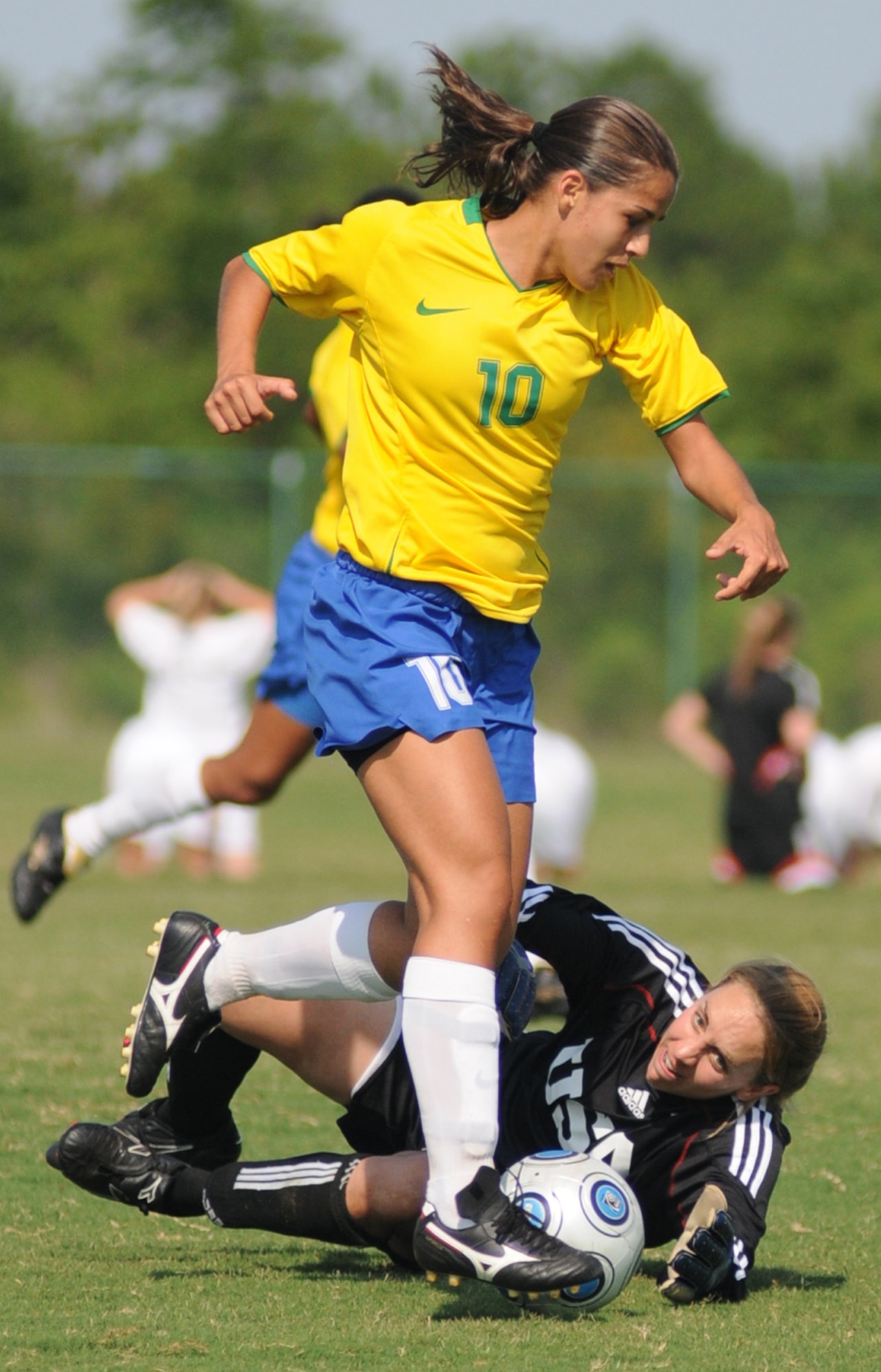 Brazil’s Rebeca Lopez De Oliveira gets the ball past USA’s Marietta Squire to score in a June 9 game at Gulfport’s Sport Complex.  Brazil won, 3-0.  (U.S. Air Force photo by Kemberly Groue)