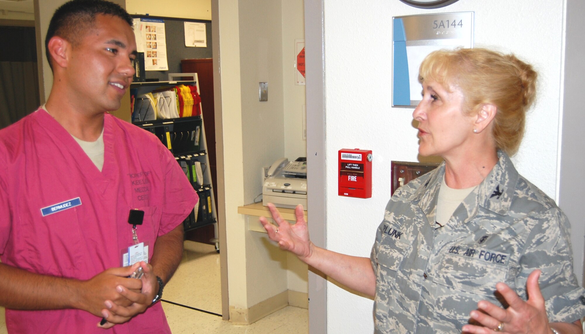Senior Airman Johann Bermudez, 81st Inpatient Operations Squadron aerospace medical service journeyman, meets his new commander, Col. Allison Plunk, as she visits the surgical inpatient unit June 10.  Colonel Plunk assumed command earlier that day from Col. Cassandra Salvatore, who becomes the 81st Medical Group’s chief nurse.  Colonel Plunk comes to Keesler from Ramstein Air Base, Germany, were she served as the deputy command nurse and chief of population health for the United States Air Forces Europe surgeon general.  (U.S. Air Force photo by Steve Pivnick)