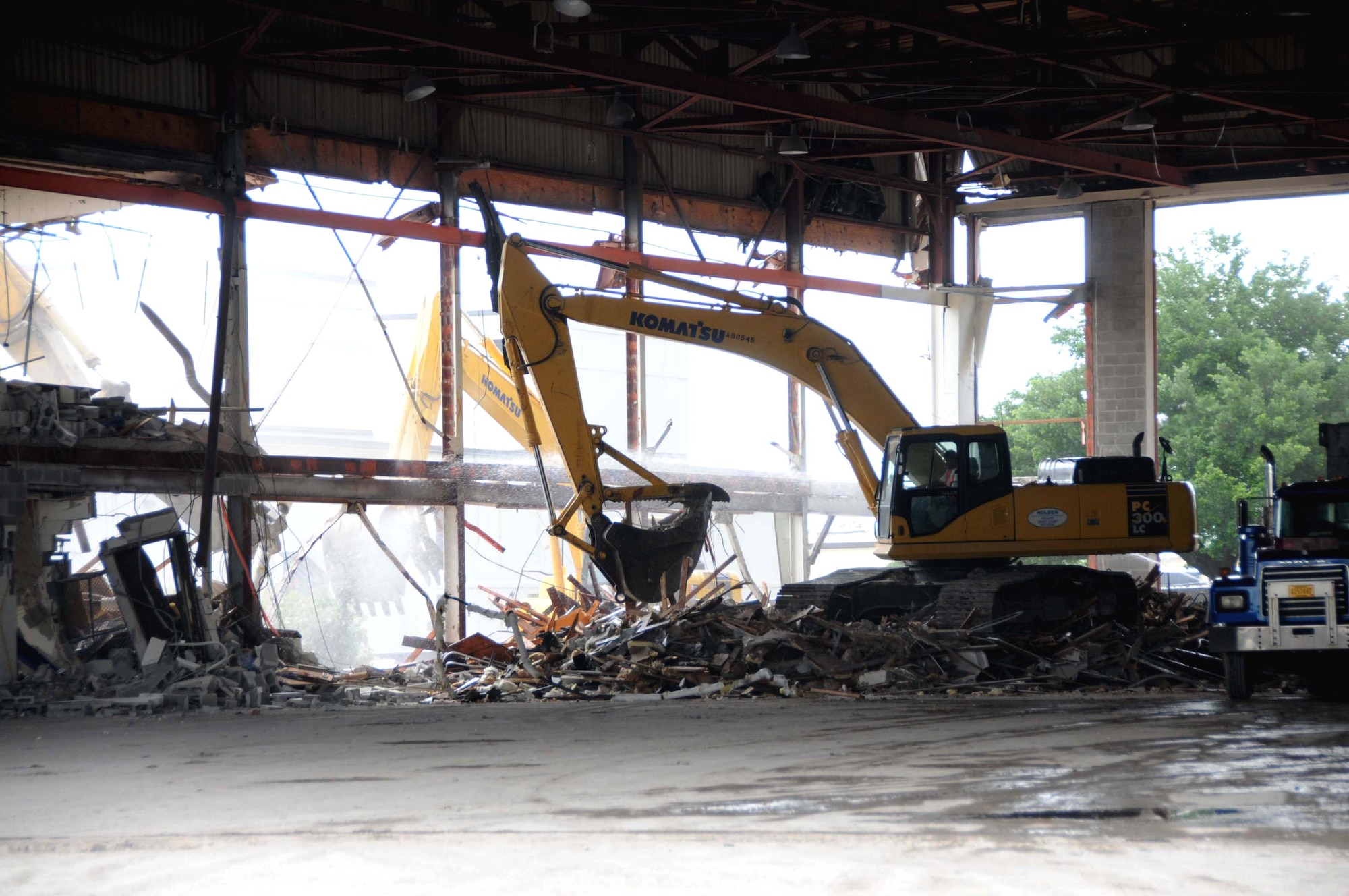 Demolition of Hangar 2, also known as Old Cody Hall, is under way.  The structure was slated for demolition after “new” Cody Hall was dedicated.  However, the building was called into service again to house employees from Sablich Center and other offices on base that were  badly damaged during Hurricane Katrina nearly four years ago.  Old Cody Hall, built in 1941, was once Keesler’s largest academic building.  In the future, it’s hoped that funding will be secured for a new training building in its place, but for now, a parking lot is planned.  (U.S. Air Force photo by Kemberly Groue)